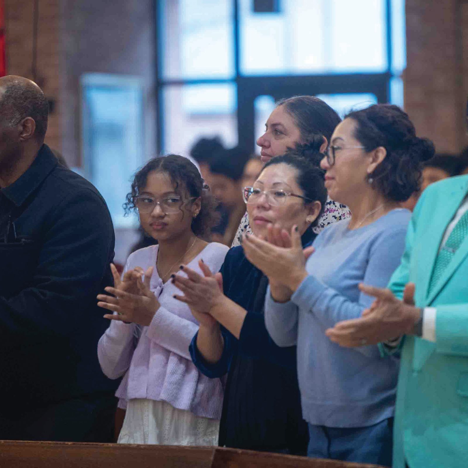 Above and below, people participate in the Jan. 18 Mass at Shrine of St. Jude Catholic Church in Rockville, Maryland that was offered in remembrance of the legacy of the Rev. Dr. Martin Luther King Jr.  the annual Mass was sponsored by the archdiocesan Secretariat for Evangelization and Synodal Renewal’s Office of Cultural Diversity and Outreach. (Catholic Standard photos by Mihoko Owada)