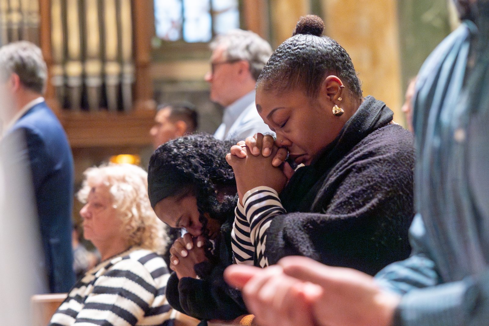 The faithful pray during a March 5 Ash Wednesday Mass at the Cathedral of St. Matthew the Apostle. About 1,000 people attended the Mass, which was Cardinal Robert McElroy’s first public Mass in the Archdiocese of Washington since Pope Francis appointed him on Jan. 6 to replace the retiring archbishop of Washington, Cardinal Wilton Gregory. (Catholic Standard Photos by Mihoko Owada)