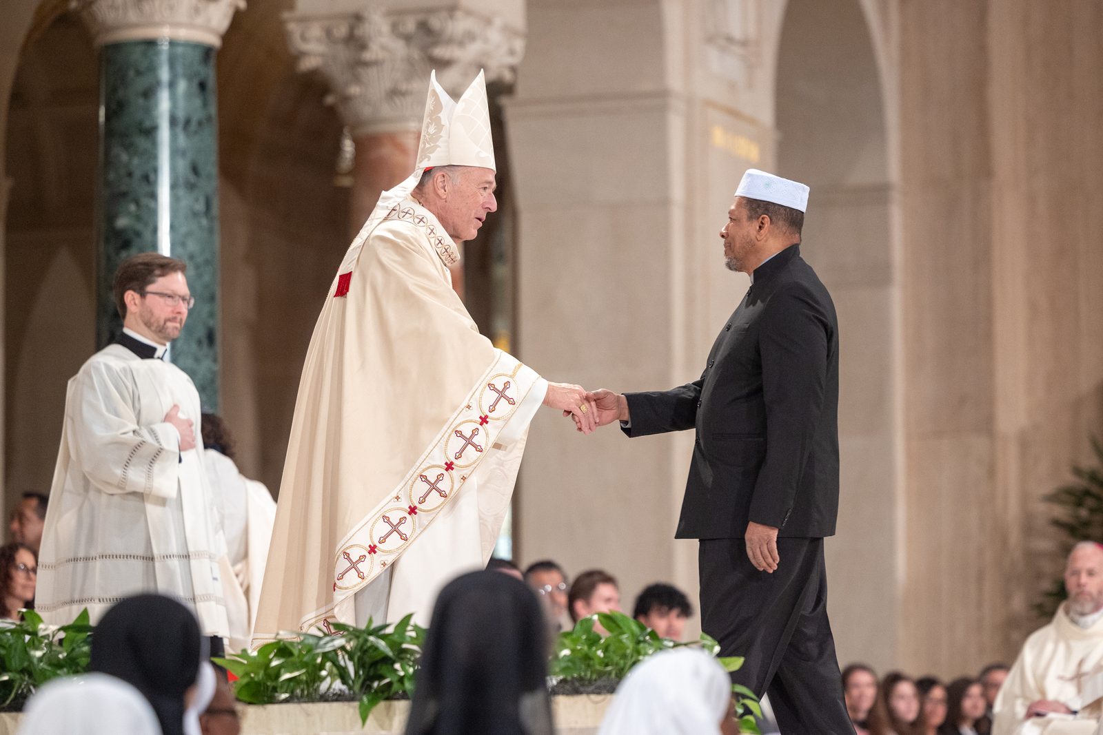 During his Solemn Mass of Installation as the new archbishop of Washington on March 11, 2025 at the Basilica of the National Shrine of the Immaculate Conception, Cardinal Robert McElroy was greeted by religious leaders of other faith communities. (Catholic Standard photo by Mihoko Owada)