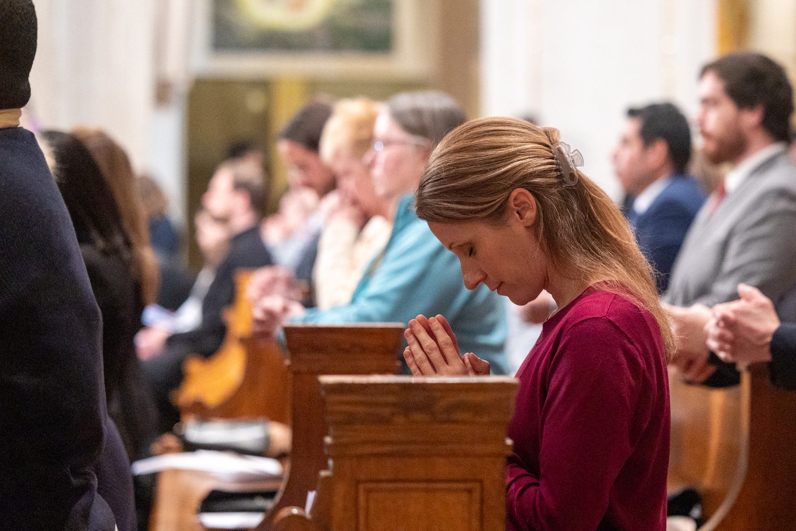 A woman prays during the Solemn Mass of Installation for Cardinal Robert McElroy as the new archbishop of Washington, which was held on March 11, 2025 at the Basilica of the National Shrine of the Immaculate Conception. (Catholic Standard photo by Mihoko Owada)