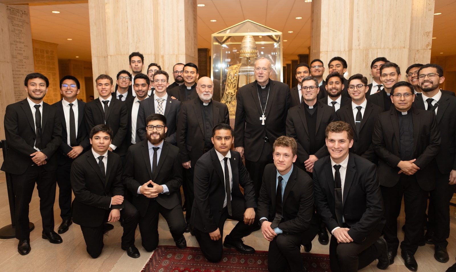 After his installation as the new archbishop of Washington on March 11, 2025 at the Basilica of the National Shrine of the Immaculate Conception, Cardinal Robert McElroy poses for a photo with seminarians and priests from the Redemptoris Mater Seminary in Hyattsville, Maryland. (Catholic Standard photo by Rachel Lincoln)
