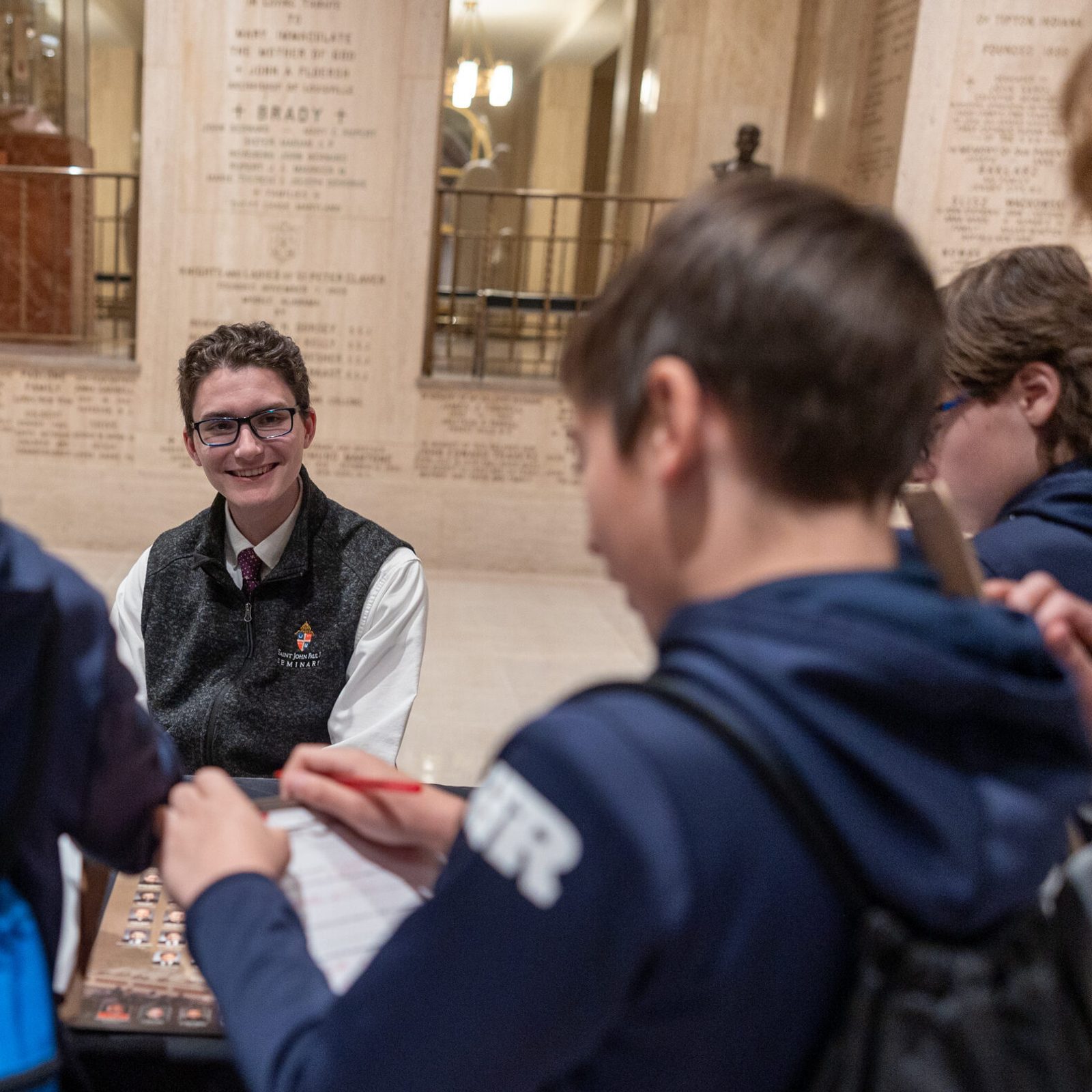 Dylan Young, a second-year seminarian at Saint John Paul II Seminary, shares his experience in formation with students during the vocations fair. “It’s the hardest and best year of my life,” he said. (Catholic Standard photo by Mihoko Owada)