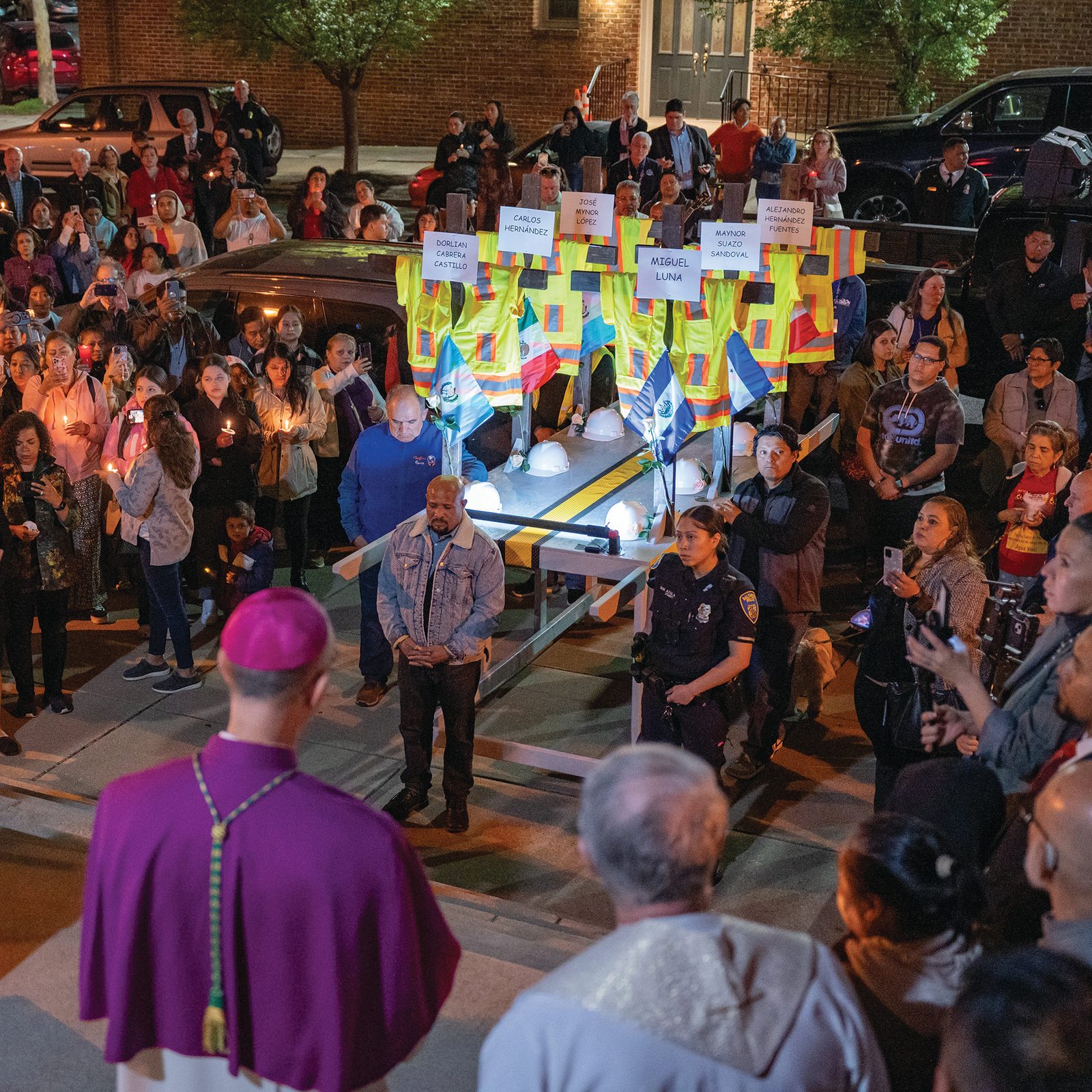 Hundreds gather outside Sacred Heart of Jesus/Sagrado Corazón de Jesús in Baltimore following an April 8, 2024, prayer service and candlelit procession in memory of the six crewmen who perished in the Francis Scott Key Bridge collapse. (OSV News photo/Kevin J. Parks, Catholic Review)