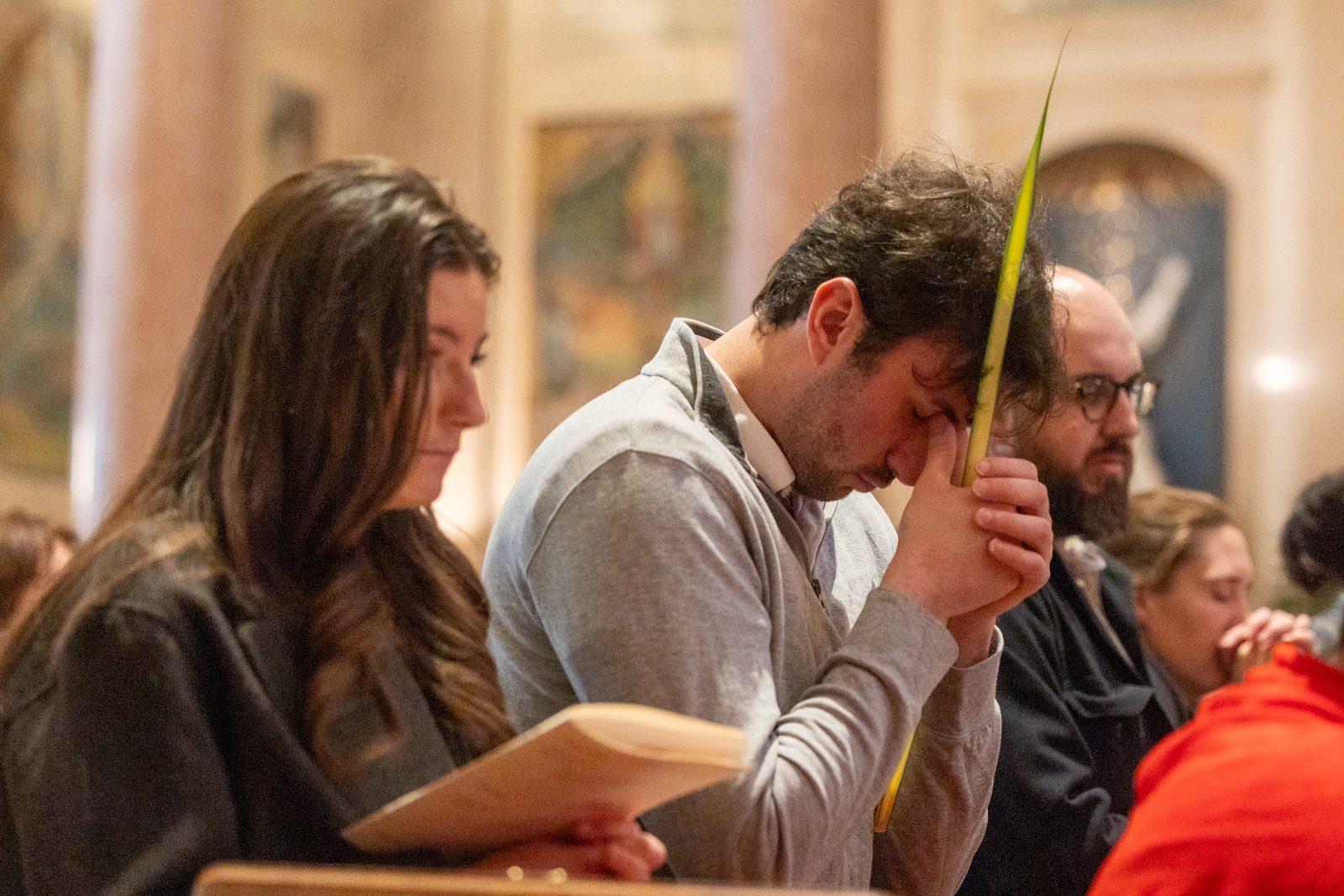 People pray during the Palm Sunday Mass on April 13, 2025, at the Cathedral of St. Matthew the Apostle in Washington, D.C. (Catholic Standard photo by Mihoko Owada)