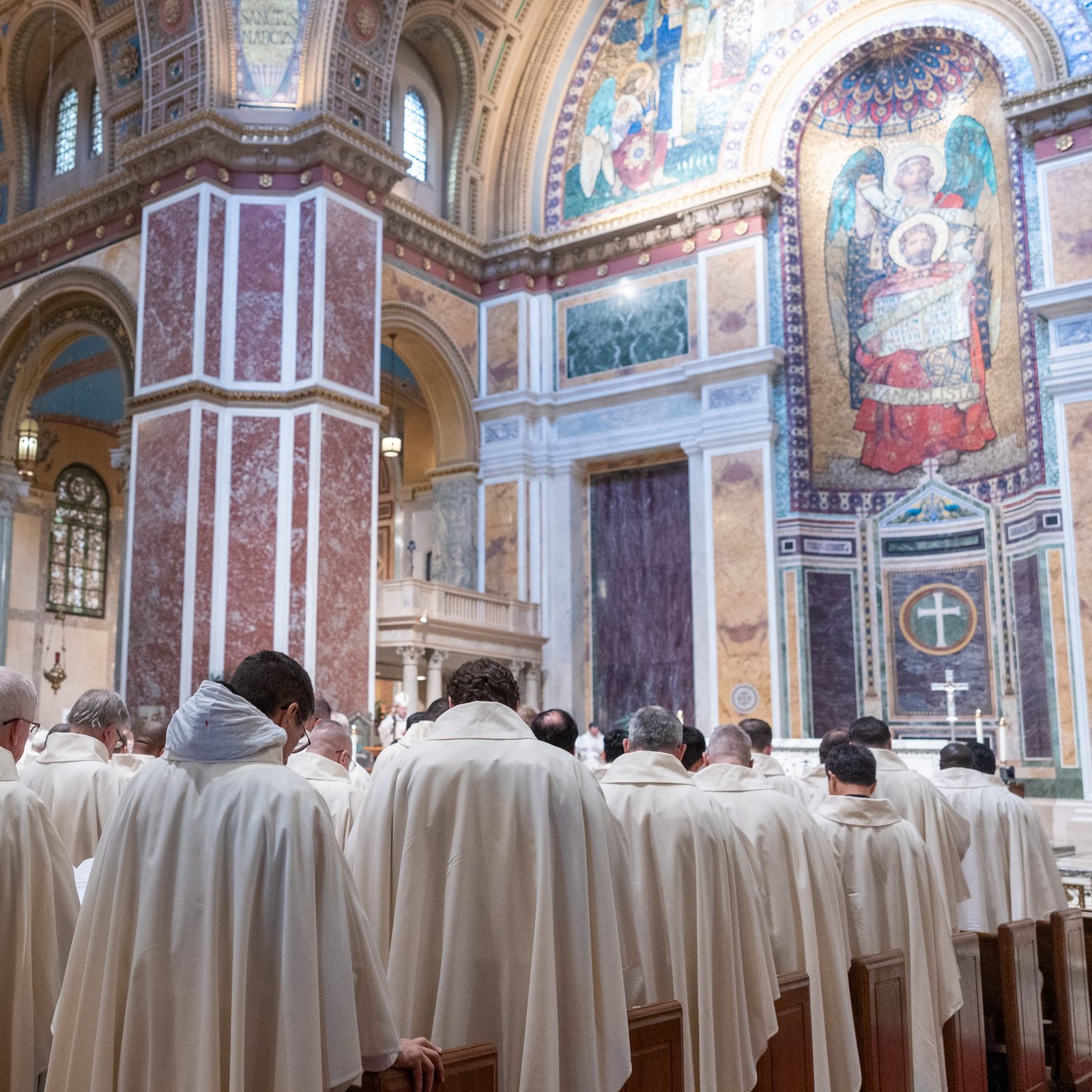 The estimated 200 priests of The Roman Catholic Archdiocese of Washington attending the Chrism Mass on April 14 at the Cathedral of St. Matthew the Apostle renew their priestly promises. (Catholic Standard photo by Mihoko Owada)