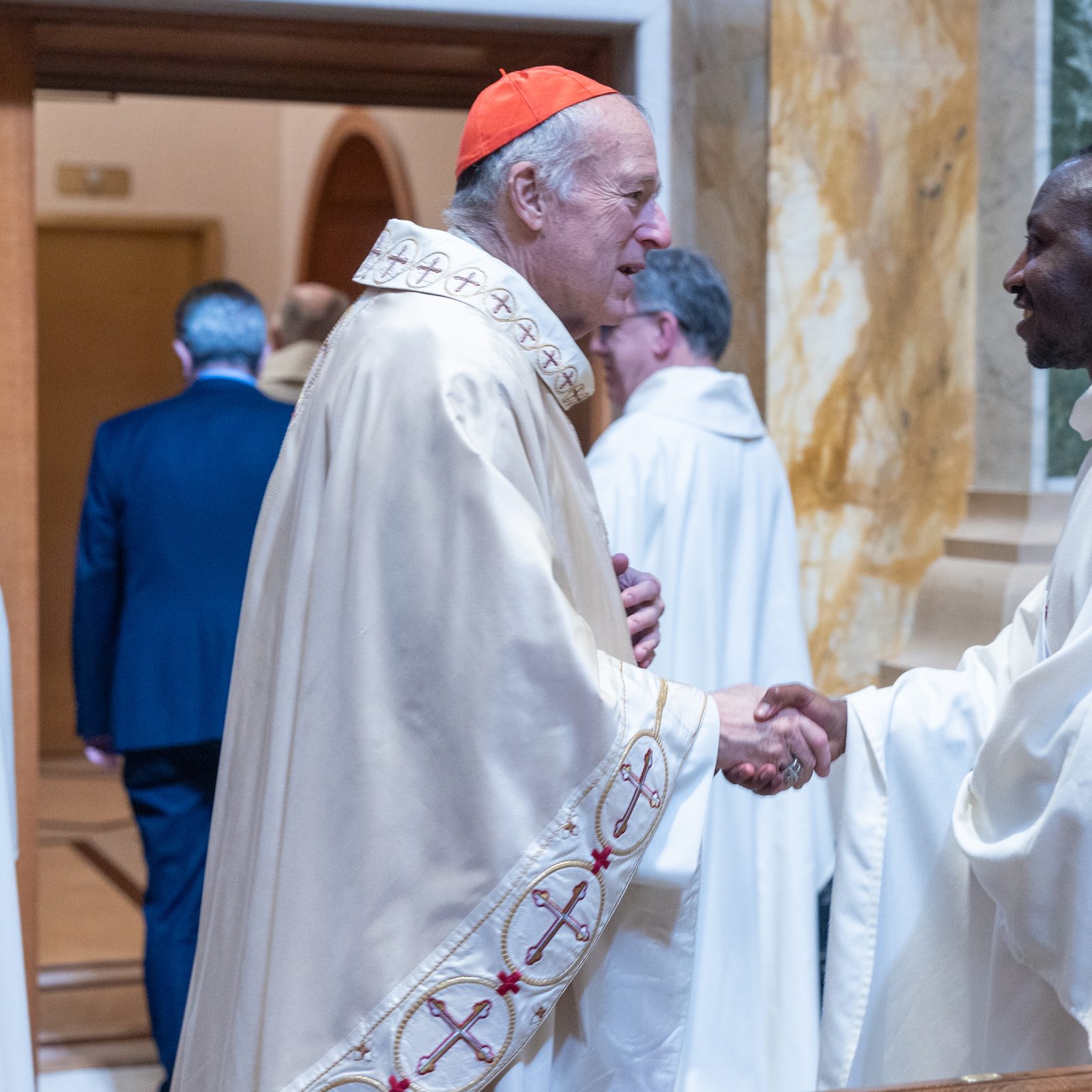 After celebrating the Chrism Mass on April 14 at the Cathedral of St. Matthew the Apostle, Cardinal Robert W. McElroy at left personally greeted the participating priests who serve in The Roman Catholic Archdiocese of Washington. (Catholic Standard photo by Mihoko Owada)