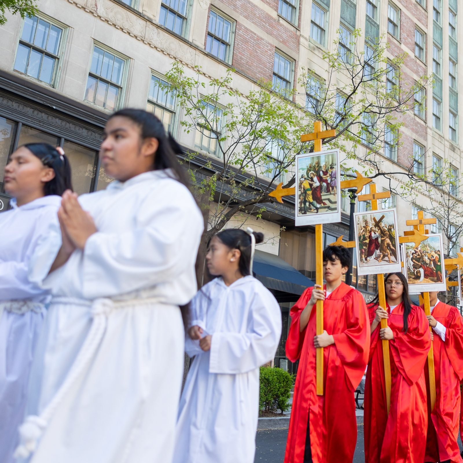Hispanic Catholics join a Way of the Cross procession through downtown Washington on Good Friday, April 18, 2025. The procession wound from Our Lady Queen of the Americas Parish to the Cathedral of St. Matthew the Apostle. (Catholic Standard photo by Mihoko Owada)