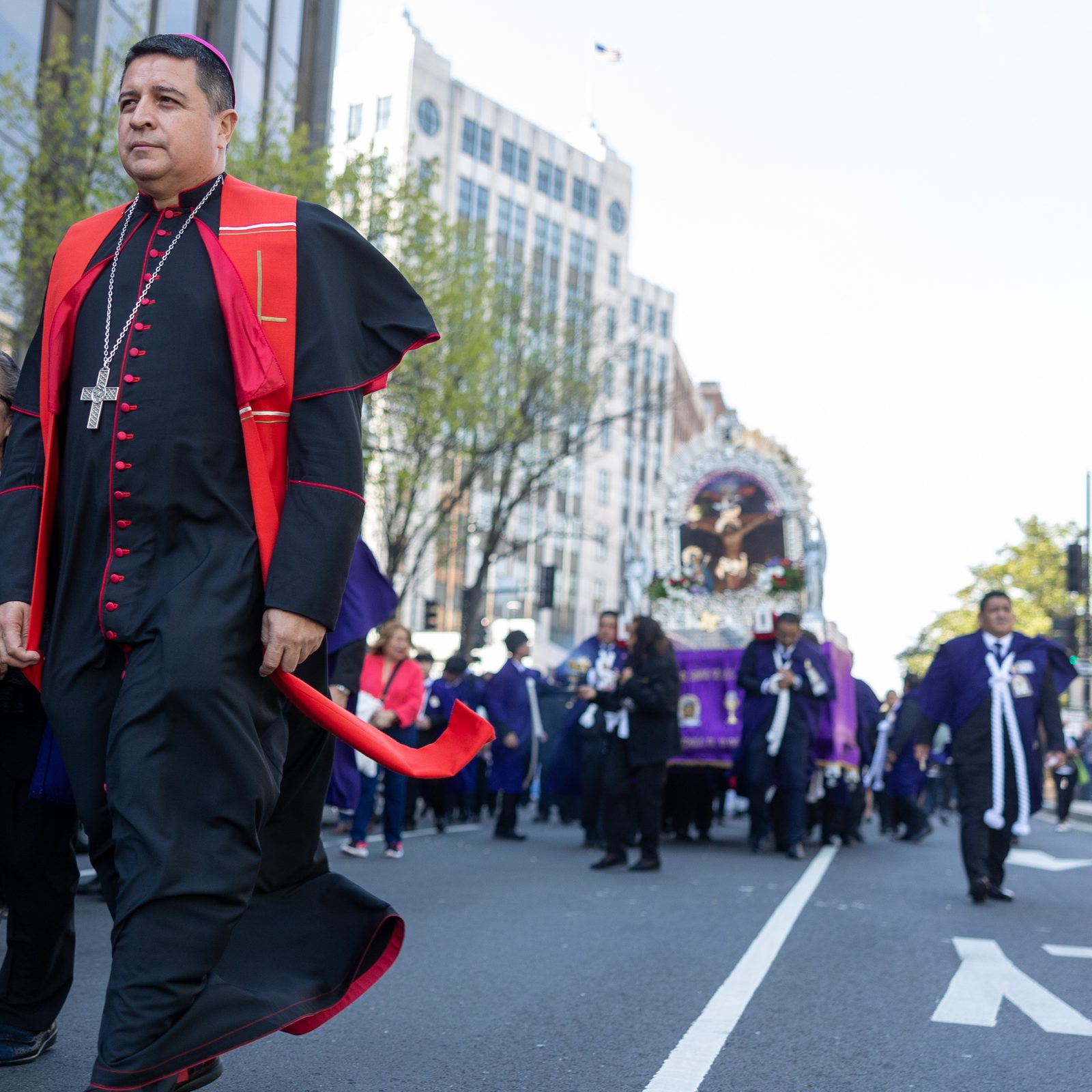 Washington Auxiliary Bishop Evelio Menjivar joins Hispanic Catholics in a Way of the Cross procession through downtown Washington on Good Friday, April 18, 2025. The procession wound from Our Lady Queen of the Americas Parish to the Cathedral of St. Matthew the Apostle. At the cathedral, Bishop Menjivar celebrated a Good Friday liturgy for Spanish-speaking Catholics. (Catholic Standard photo by Mihoko Owada)