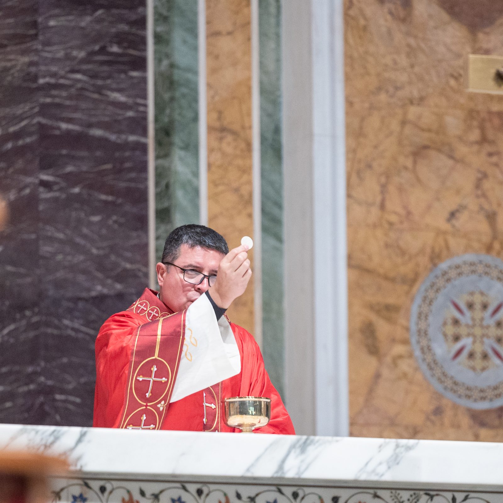 Washington Auxiliary Bishop Evelio Menjivar leads a Good Friday liturgy for Spanish-speaking Catholics on April 18 at the Cathedral of St. Matthew the Apostle. (Catholic Standard photo by Mihoko Owada)