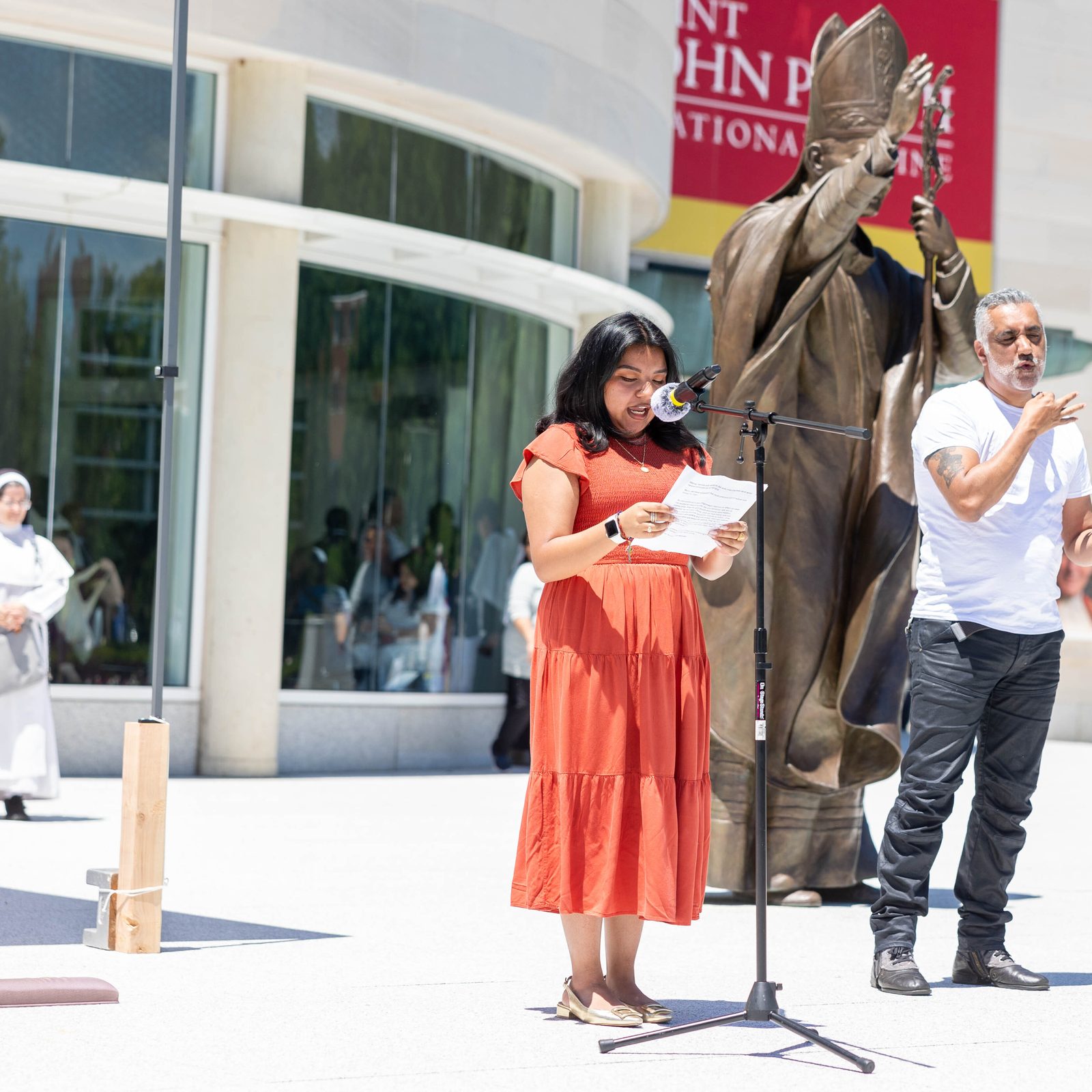 Fatima Vasquez-Molina speaks during a catechesis on the Eucharist outside the Saint John Paul II National Shrine in Washington on June 8. (Catholic Standard photo by Mihoko Owada)