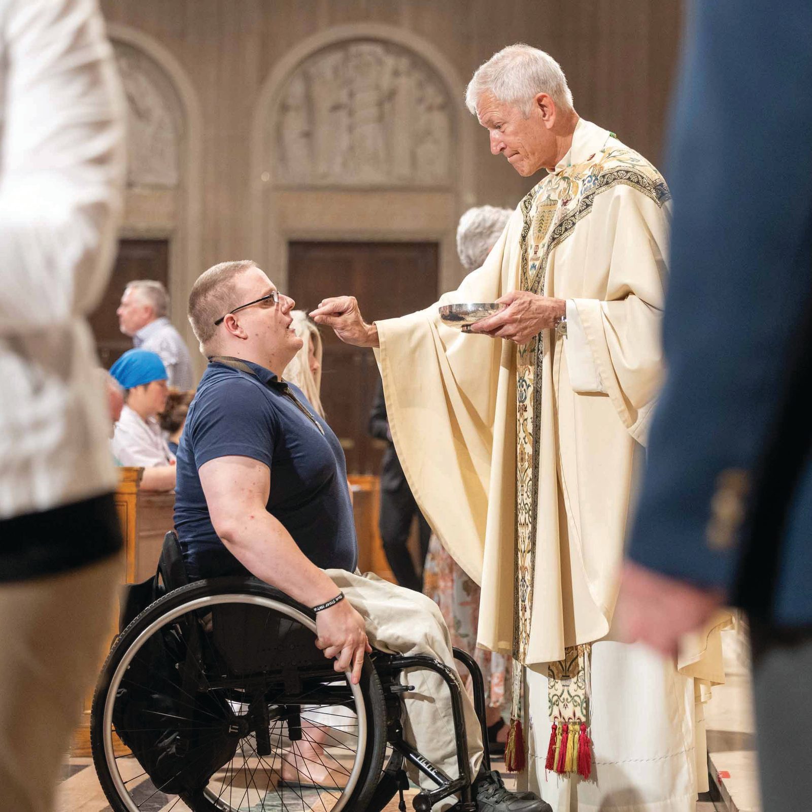 Bishop-elect Gary Studniewski distributes Holy Communion during a June 6 Vigil Mass for the Solemnity of Corpus Christi he celebrated at the Basilica of the National Shrine of the Immaculate Conception as part of the National Eucharistic Pilgrimage’s visit to the Roman Catholic Archdiocese of Washington. (Catholic Standard photo by Mihoko Owada)