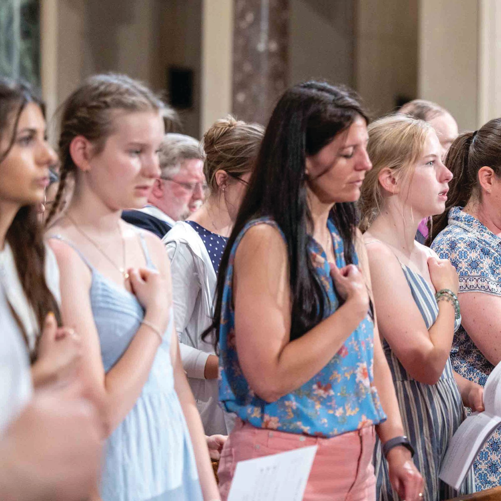 The faithful pray during a June 6 Vigil Mass for the Solemnity of Corpus Christi he celebrated at the Basilica of the National Shrine of the Immaculate Conception as part of the National Eucharistic Pilgrimage’s visit to the Roman Catholic Archdiocese of Washington. During the Mass, they were reminded that those who partake in the Eucharist “participate in the very life of Jesus – to have a share in the life of God Himself.” (Catholic Standard photo by Mihoko Owada)