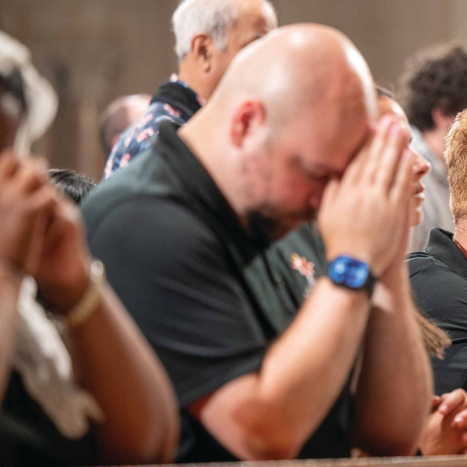 Zachary Dotson and John Paul Flynn, two of the nine young adult “perpetual pilgrims” traveling with the Eucharist along the East Coast during the 2026 National Eucharistic Pilgrimage, pray during a Vigil Mass for the Solemnity of the Most Holy Body and Blood of Christ on June 6 at the Basilica of the National Shrine of the Immaculate Conception. (Catholic Standard photo by Mihoko Owada)