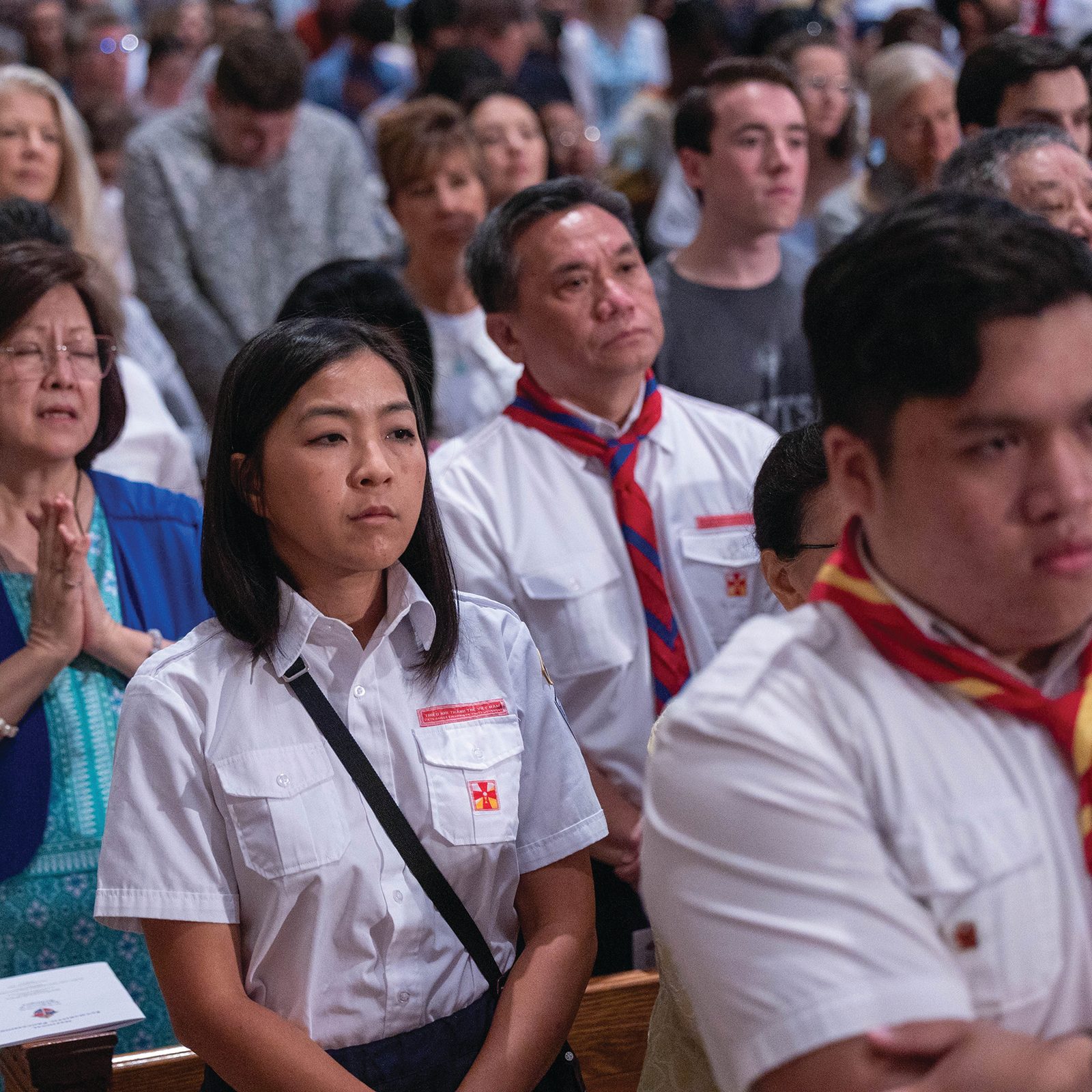 Above and below, people pray during Mass at the Basilica of the National Shrine of the Immaculate Conception prior to the June 8 Eucharistic procession in Washington, D.C. At the Mass, the procession participants were  urged to “let our hearts exult in the Lord and rejoice in His love. (CS photos by Mihoko Owada)
