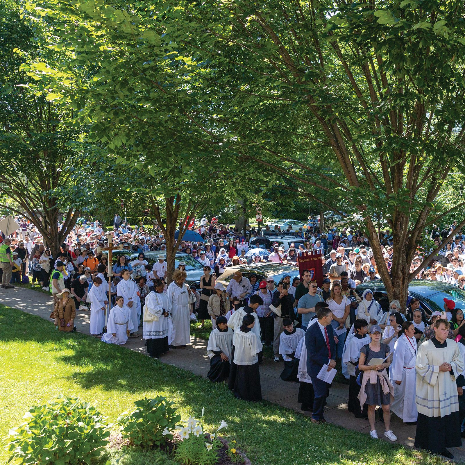 More than 1,200 people took to the streets of Washington, D.C. to sing, pray and walk in procession as they celebrated their belief that the Eucharist truly is the Body, Blood, Soul and Divinity of Jesus Christ. (CS photo by Mihoko Owada)