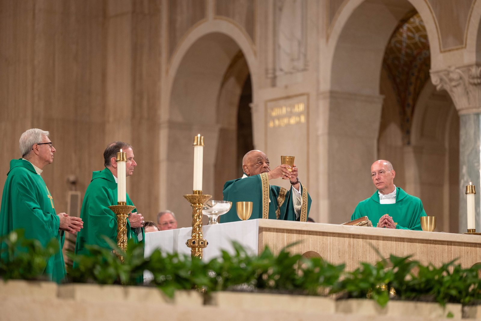 Washington Cardinal Wilton Gregory at center celebrates the National Eucharistic Pilgrimage Mass on June 9, 2024 at the Basilica of the National Shrine of the Immaculate Conception. The concelebrants at the Mass included, at left, Msgr. Vito A. Buonanno, the director of pilgrimages at the basilica, and Arlington Bishop Michael F. Burbidge; and at right, Msgr. Walter R. Rossi, the basilica’s rector. The Mass marked the closing event of the National Eucharistic Pilgrimage stop in the nation’s capital. (Catholic Standard photo by Mihoko Owada)