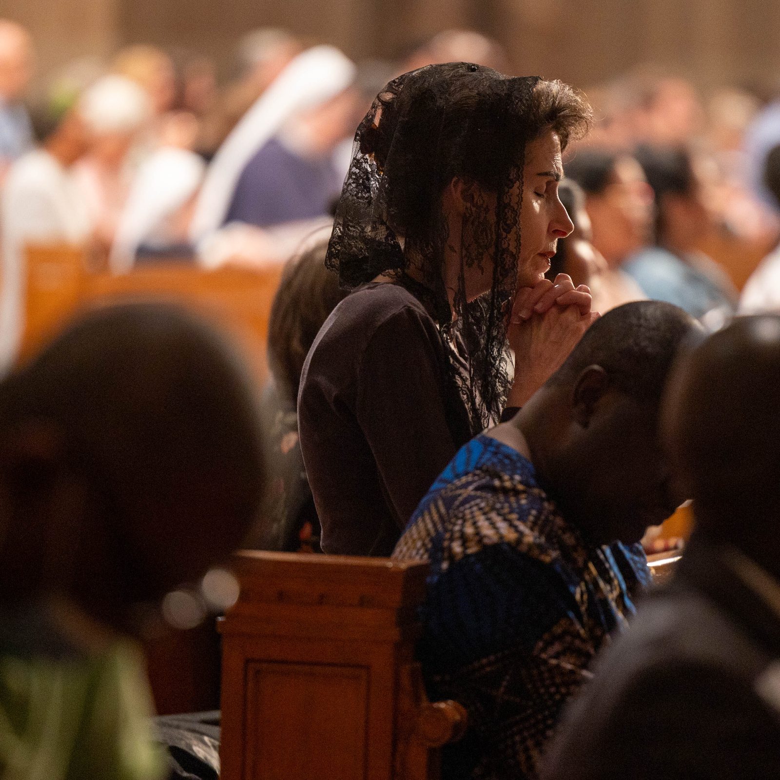 People pray during the National Eucharistic Pilgrimage Mass on June 9, 2024 at the Basilica of the National Shrine of the Immaculate Conception. The Mass marked the closing event of the National Eucharistic Pilgrimage stop in the nation’s capital. (Catholic Standard photos by Mihoko Owada)