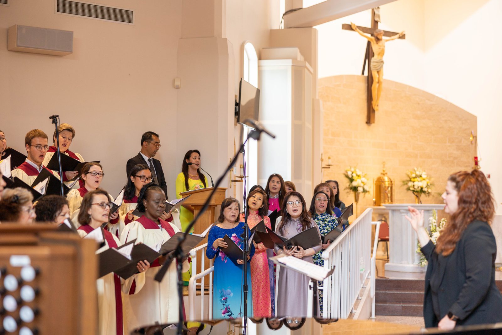 Members of the Vietnamese choir at Mother Seton Parish in Germantown join the parish’s choir in singing a prelude before a Mass on June 30, 2024 celebrated by Cardinal Wilton Gregory that marked the Maryland parish’s 50th anniversary. (Catholic Standard photos by Mihoko Owada)