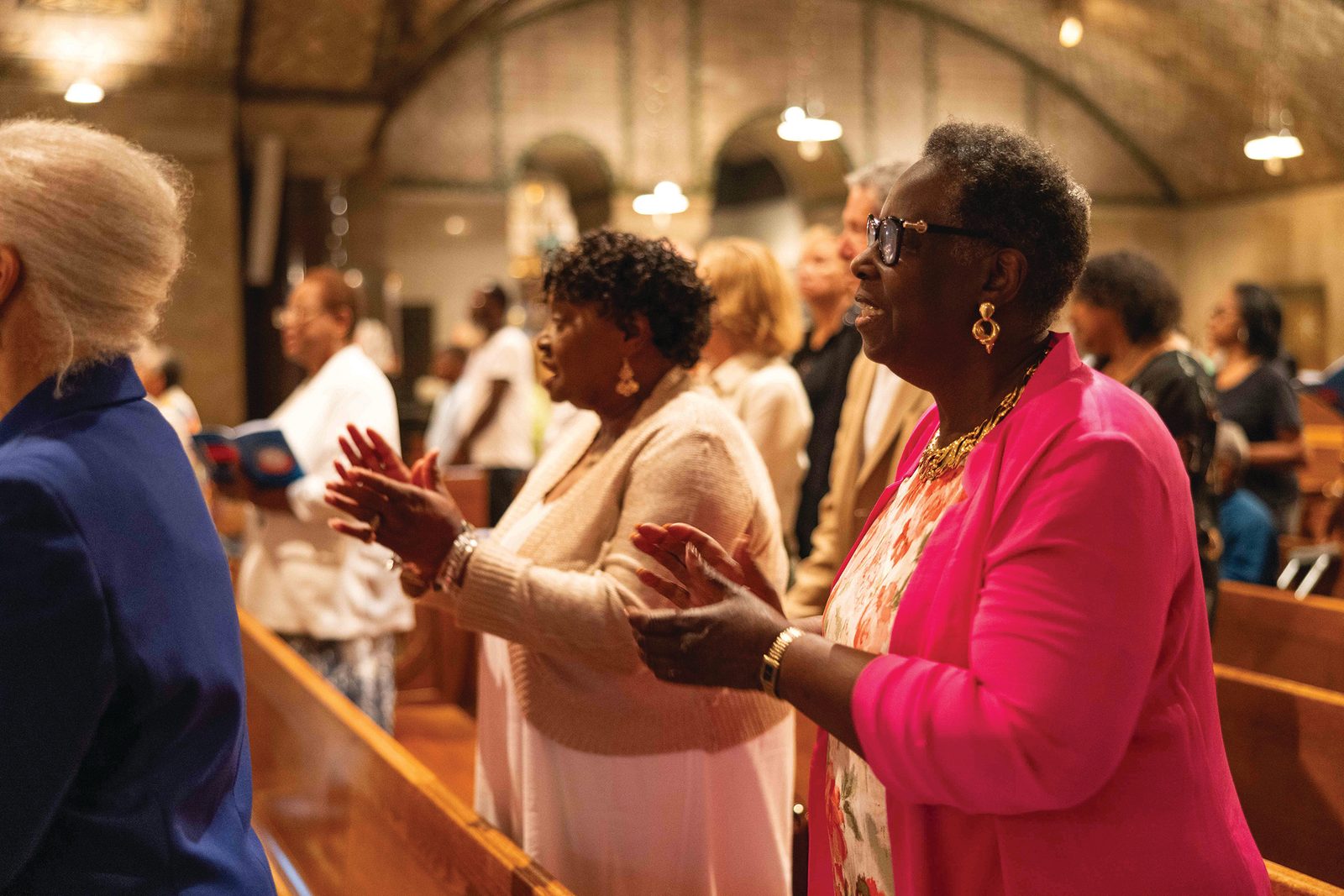 People sing during the June 29 Mass of Thanksgiving in the Crypt Church of the Basilica of the National Shrine of the Immaculate Conception honoring the life and legacy of Father Clarence Rivers. The late priest, composer, artist and liturgist was hailed as “exactly what our Church needed even before the Church knew it needed him.” (CS photo by Andrew Biraj)