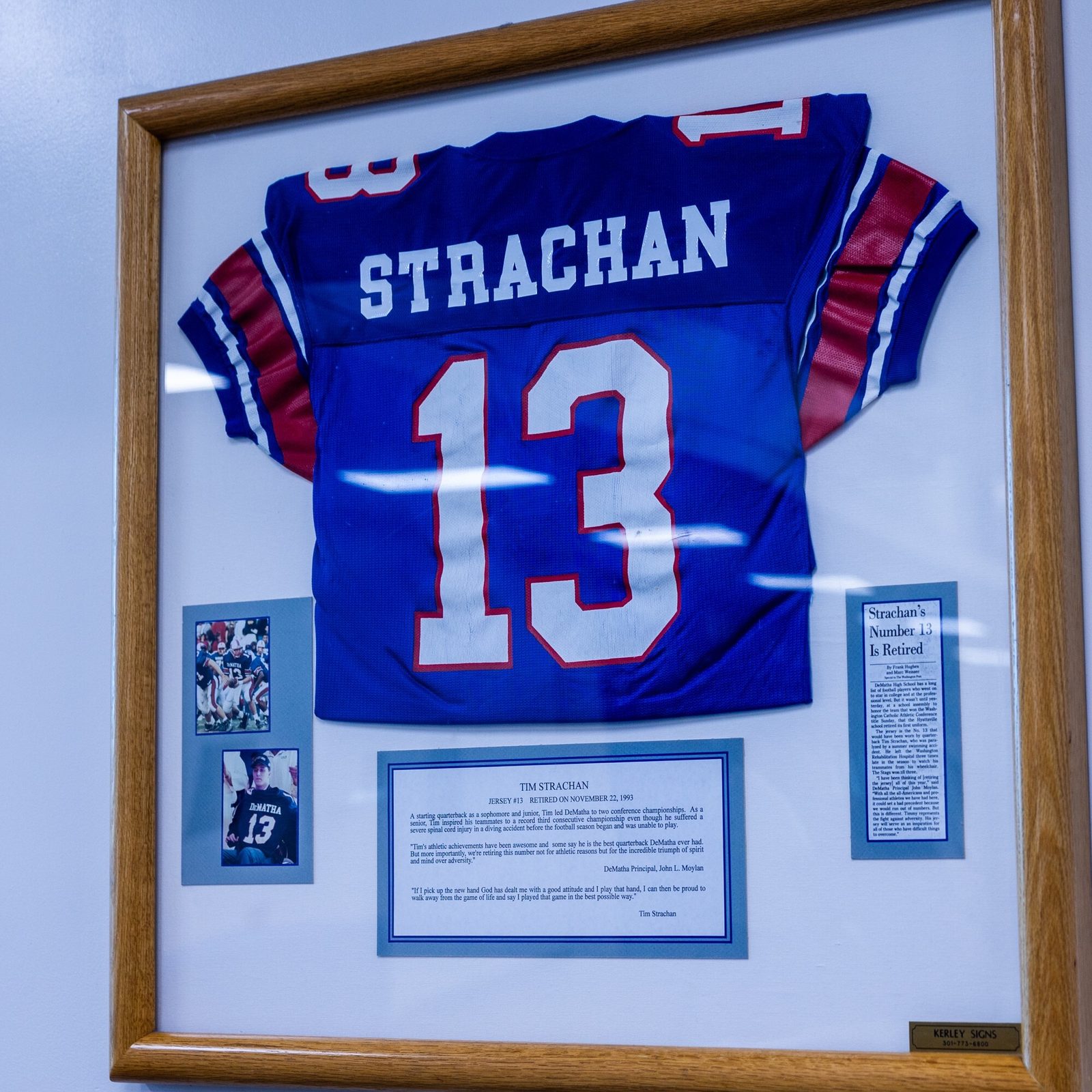 DeMatha Catholic High School in Hyattsville, Maryland retired the number 13 football jersey of Tim Strachan, who had led the Stags to two straight Washington Catholic Athletic Conference championships and was one of the nation’s top-ranked prep quarterbacks before he was paralyzed in a swimming accident in 1993. Strachan, who went on to earn a law degree from Georgetown and work as an attorney, was well-known locally as a motivational speaker and for broadcasting University of Maryland football games. He died on July 8 at the age of 49. His jersey is displayed at DeMatha’s Lt. (SEAL) Brendan Looney ’99 Convocation Center. (Catholic Standard photo by Mihoko Owada)