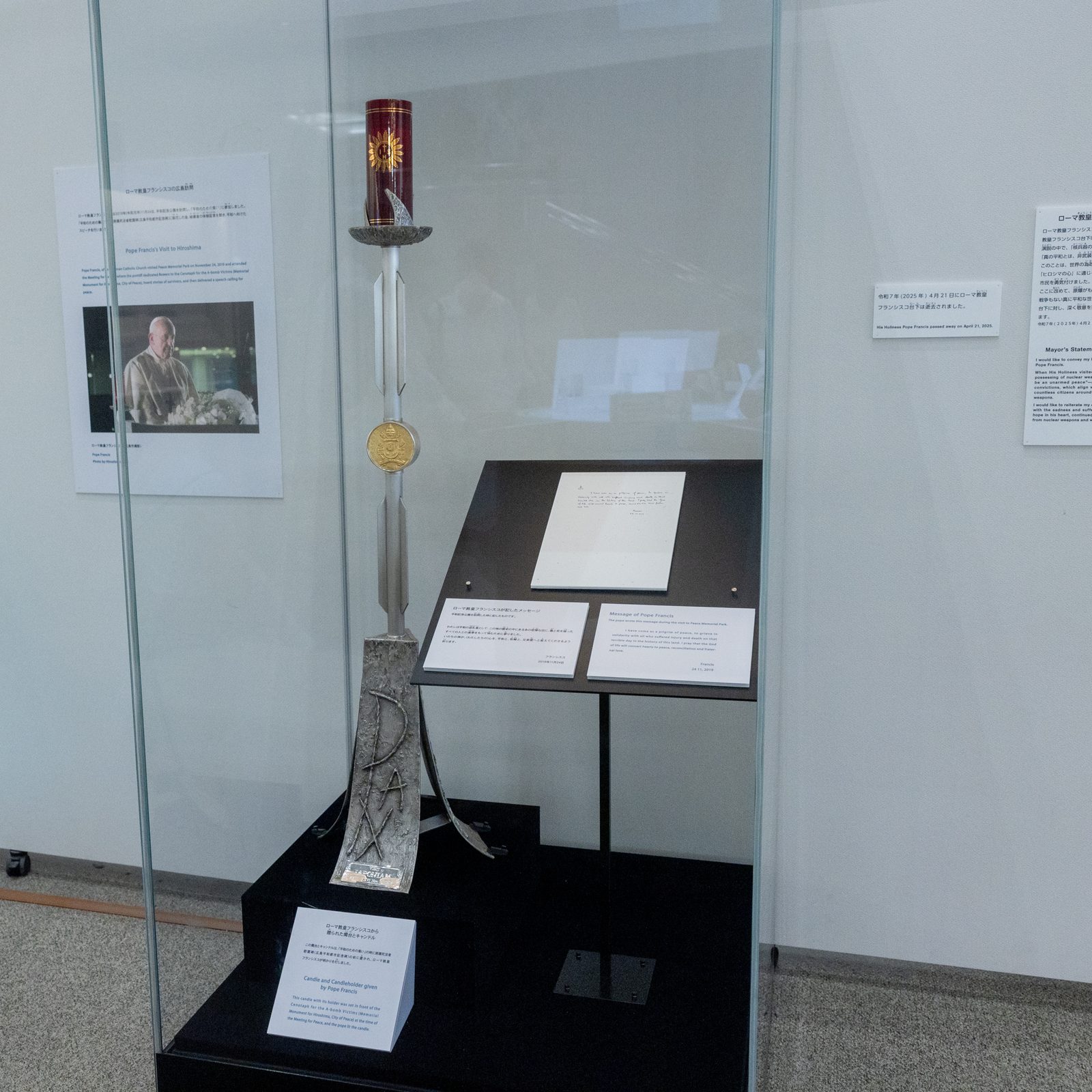 On August 4, a display of the Pope Francis’s message and candleholder given to Hiroshima City is seen at the Hiroshima Peace Memorial Museum. (Catholic Standard photo by Mihoko Owada)