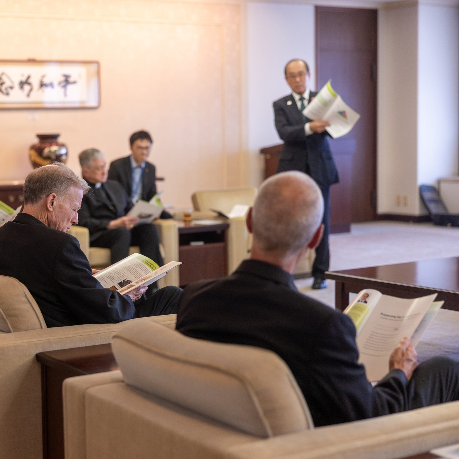 During an August 5 meeting with the mayor of Hiroshima, Kazumi Matsui, the U.S. archbishops and university representatives listen to the mayor's presentation on Hiroshima's initiatives "Promoting a culture of Peace". (Catholic Standard photo by Mihoko Owada)