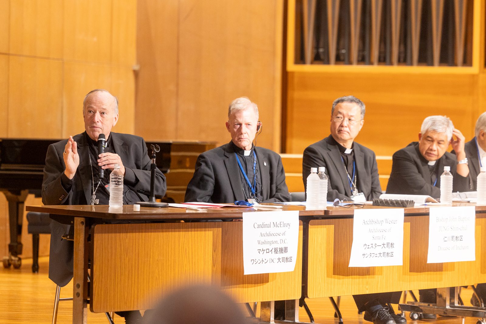 Washington Cardinal Robert W. McElroy, at left, speaks at a dialogue on Aug. 5, 2025 hosted by the Diocese of Hiroshima during a Pilgrimage of Peace to Hiroshima and Nagasaki by four U.S. archbishops and by leaders and students from U.S. Catholic universities that coincided with the 80th anniversary of the atomic bombings of those two cities in Japan. From left to right are Cardinal McElroy; Archbishop John C. Wester of Santa Fe, New Mexico; Bishop John Baptist Jung Shin-chul of the Diocese of Incheon in South Korea; and Bishop Edgar Gacutan of the Diocese of Sendai in Japan. (Catholic Standard photo by Mihoko Owada)
