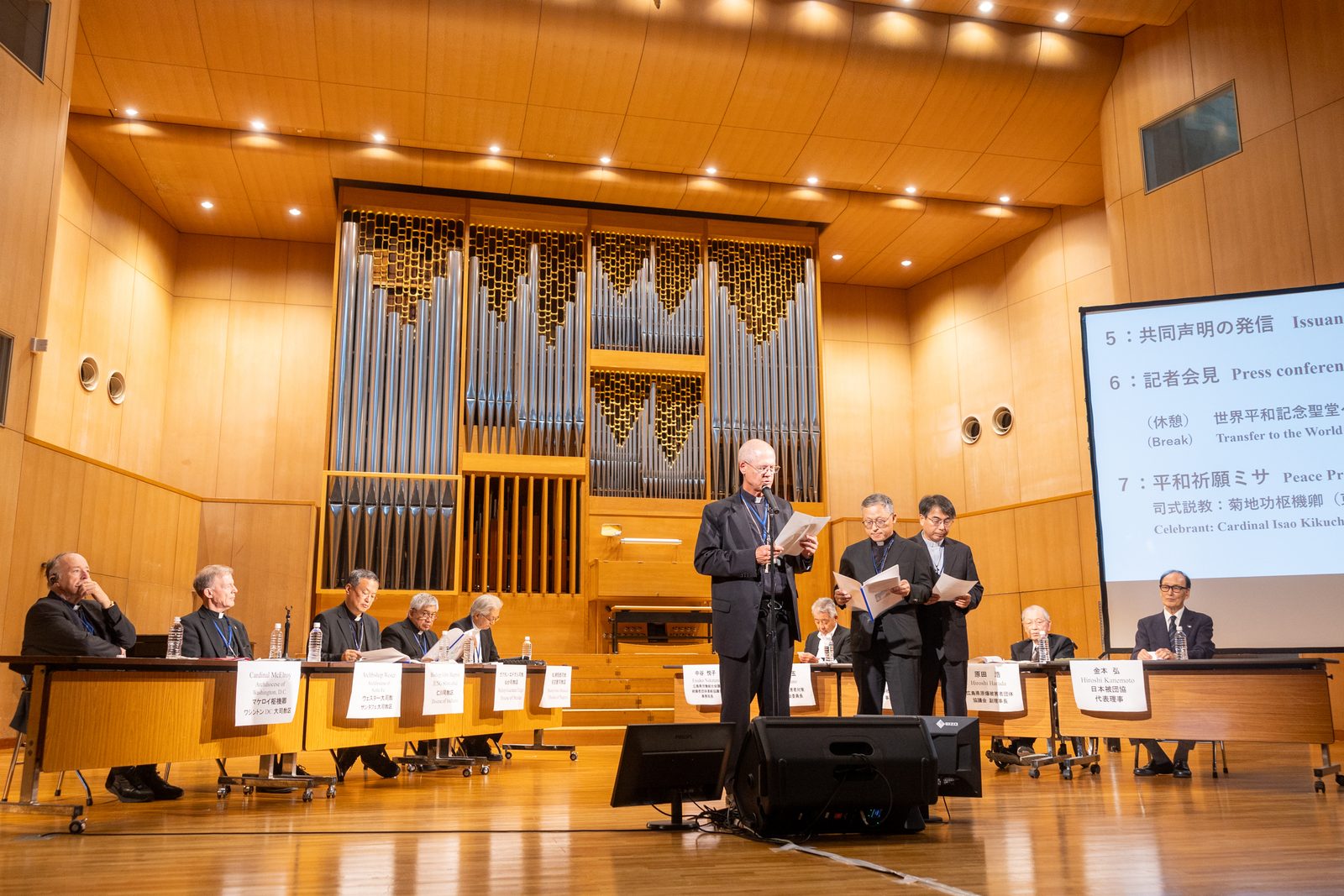 A joint statement, "Toward Solidarity to Protect All Life" is presented in three languages, English, Korean and Japanese by Archbishop Paul D. Etienne of Seattle; Bishop Simon Kim Ju-young of Chuncheon, South Korea; and Archbishop Peter Michiaki Nakamura of Nagasaki, Japan, at a peace event on Aug. 5, 2025 hosted by the Diocese of Hiroshima where atomic bombing survivors were honored. (Catholic Standard photo by Mihoko Owada)