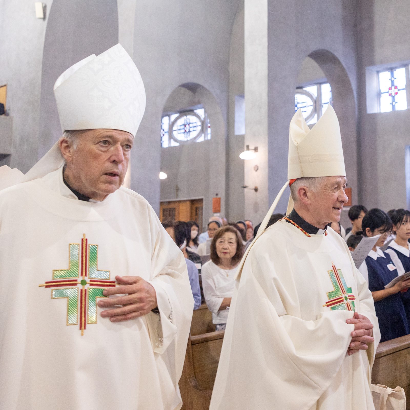 Cardinal Robert W. McElroy of Washington and Cardinal Blase J. Cupich of Chicago process to the altar at the beginning of a Peace Memorial Mass at the Memorial Cathedral for World Peace in Hiroshima, Japan, on Aug. 5, 2025. They were part of a Pilgrimage of Peace to Hiroshima and Nagasaki, Japan, coinciding with the 80th anniversary of the U.S. atomic bombings of those cities. (Catholic Standard photo by Mihoko Owada)