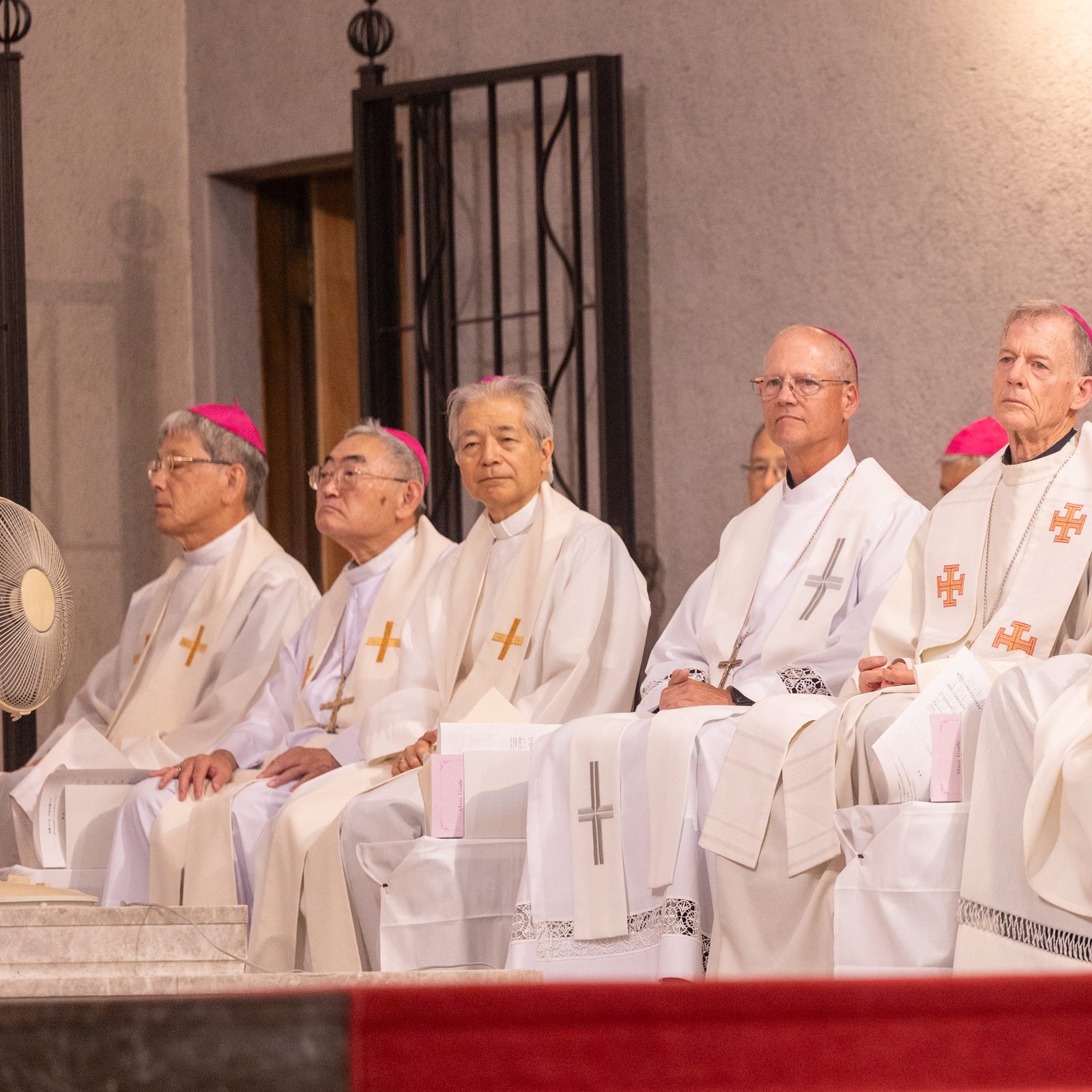 The U.S. archbishops concelebrating a Peace Memorial Mass on Aug. 5, 2025 at the Memorial Cathedral for World Peace in Hiroshima included Seattle Archbishop Paul D. Etienne (third from right), Archbishop John C. Wester of Santa Fe, New Mexico (second from right), and Washington Cardinal Robert W. McElroy (at right). (Catholic Standard photo by Mihoko Owada)