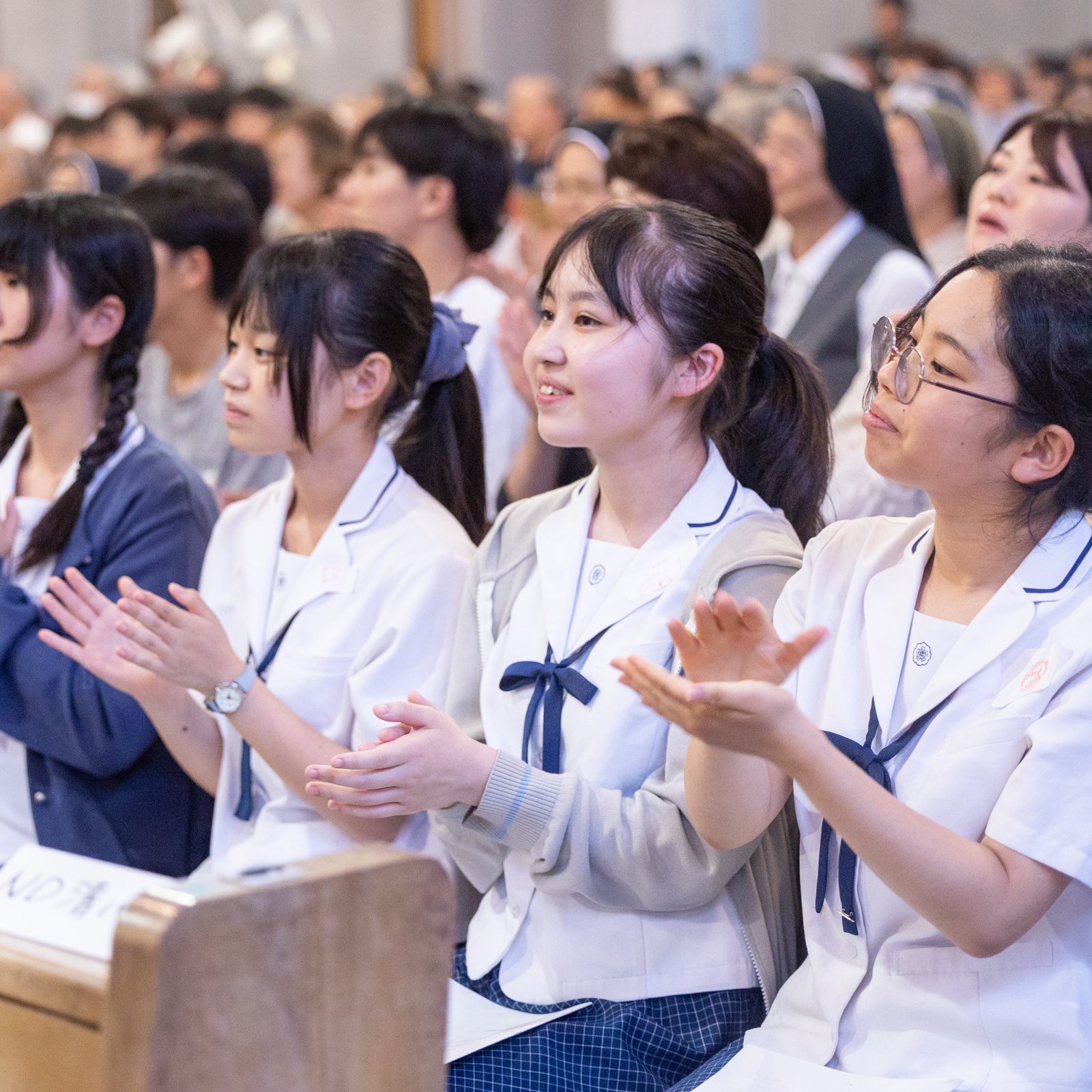 Japanese students welcome U.S. archbishops to Hiroshima during a Peace Memorial Mass on Aug. 5, 2025 at the Memorial Cathedral for World Peace. (Catholic Standard photo by Mihoko Owada)