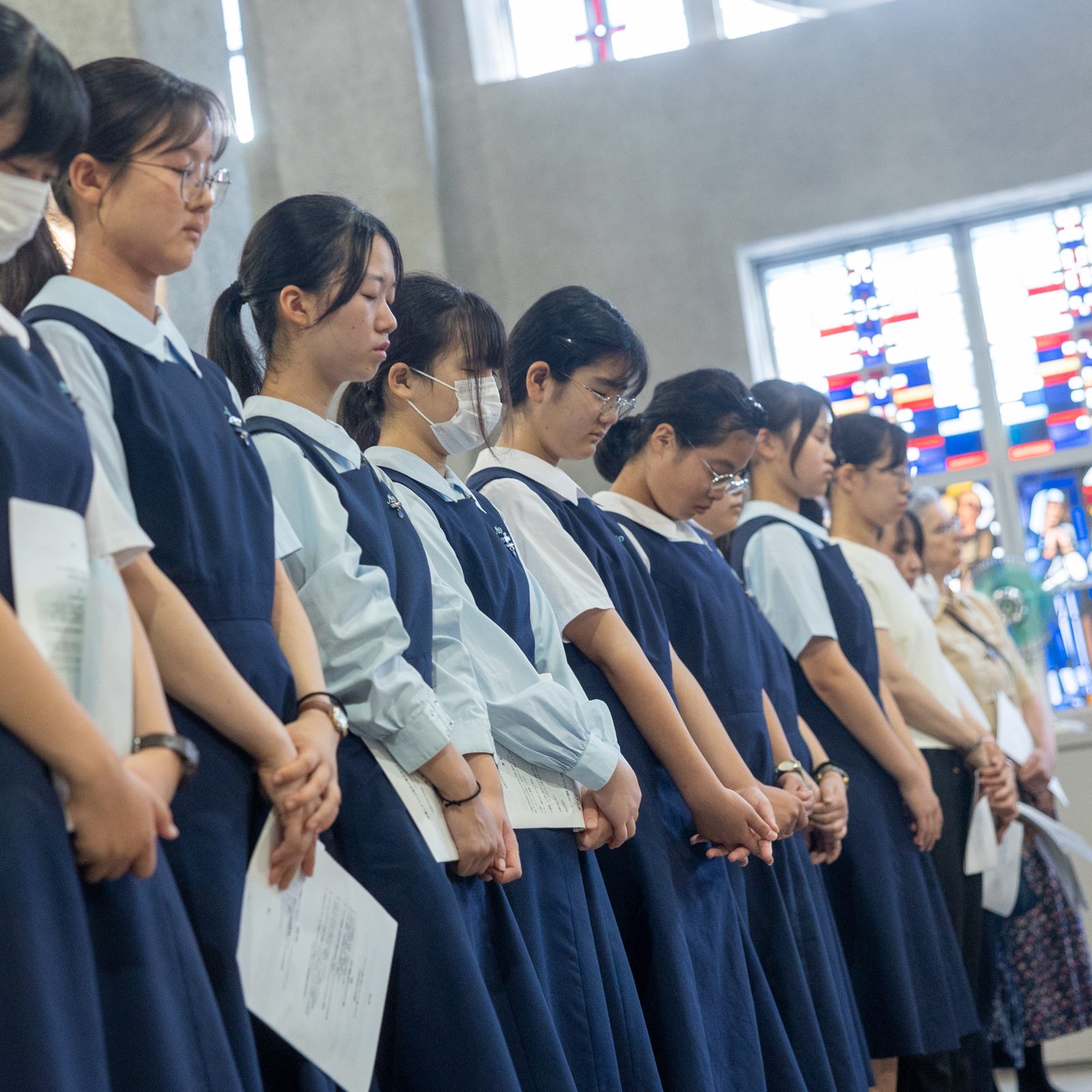 On August 6, 2025 at 8:15 a.m., the moment the United States dropped the first atomic bomb in human history on Hiroshima, Japan, 80 years earlier on Aug. 6, 1945, people observe a moment of silence for the victims of the atomic bombings while sirens sound and church bells ring for one minute during the annual Peace Memorial Mass at the Memorial Cathedral for World Peace in Hiroshima. (Catholic Standard photo by Mihoko Owada)