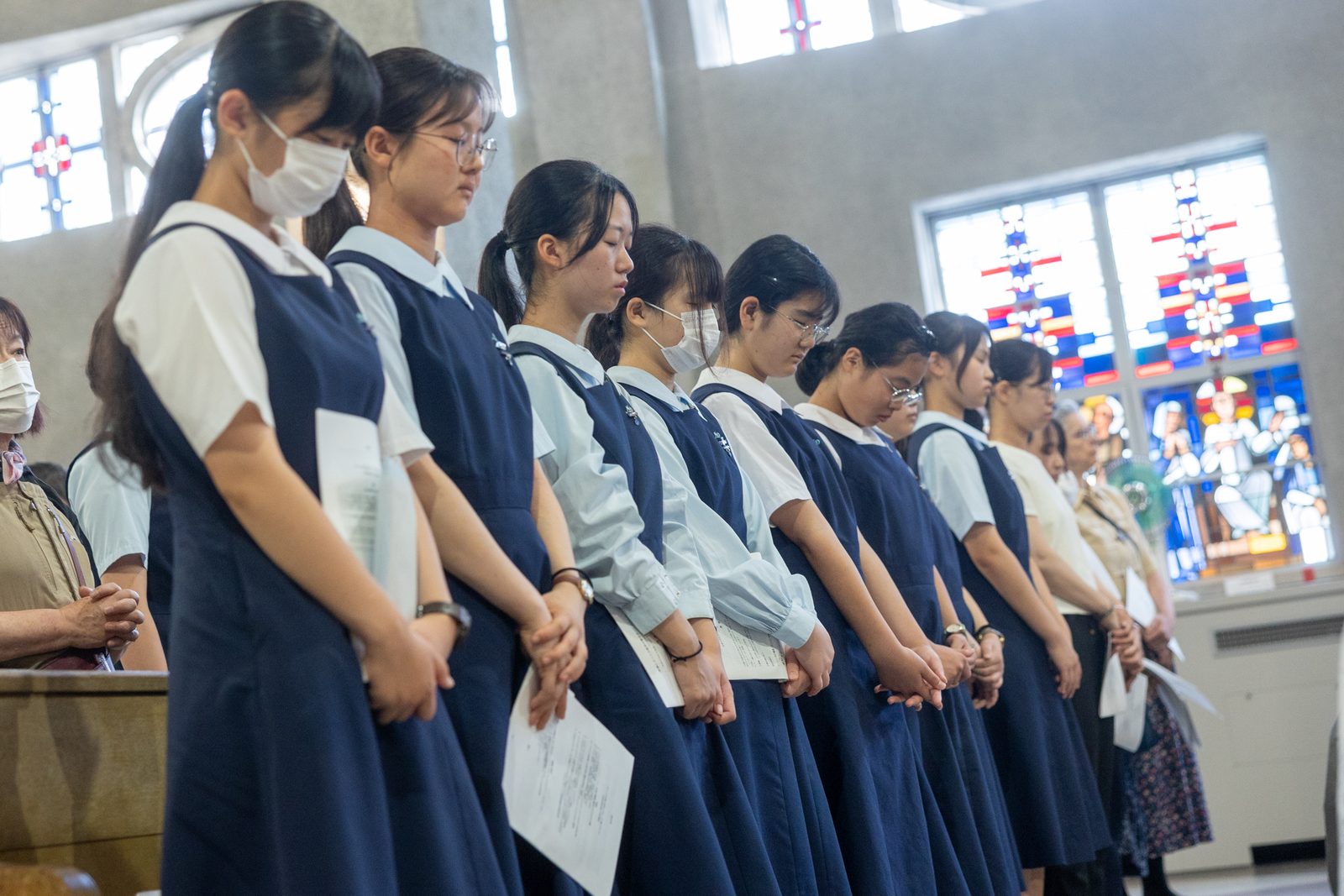 On August 6, 2025 at 8:15 a.m., the moment the United States dropped the first atomic bomb in human history on Hiroshima, Japan, 80 years earlier on Aug. 6, 1945, people observe a moment of silence for the victims of the atomic bombings while sirens sound and church bells ring for one minute during the annual Peace Memorial Mass at the Memorial Cathedral for World Peace in Hiroshima. (Catholic Standard photo by Mihoko Owada)