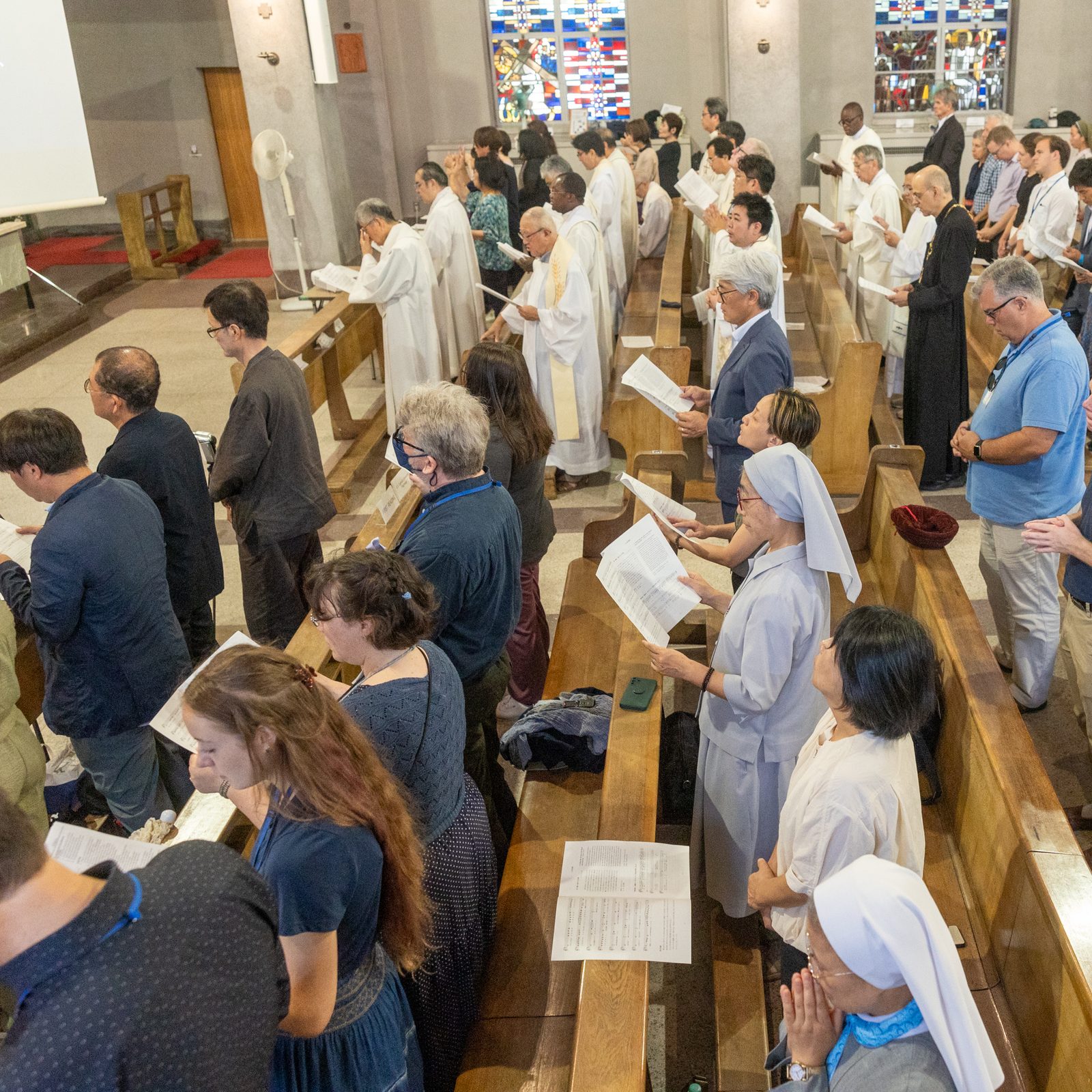 People pray during a Mass on Aug. 6, 2025 at the World Peace Memorial Cathedral in Hiroshima, Japan, for the Victims of the Atomic Bombing. (Catholic Standard photo by Mihoko Owada)