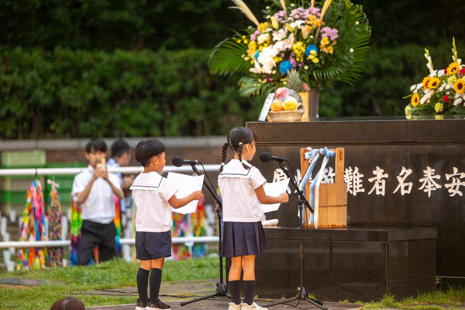 At the Atomic Bomb Hypocenter in Nagasaki, kindergarteners deliver a pledge for peace during the 53rd Memorial Service for the Victims of the Atomic Bombing on the evening of August 8, 2025. (Catholic Standard photo by Mihoko Owada)