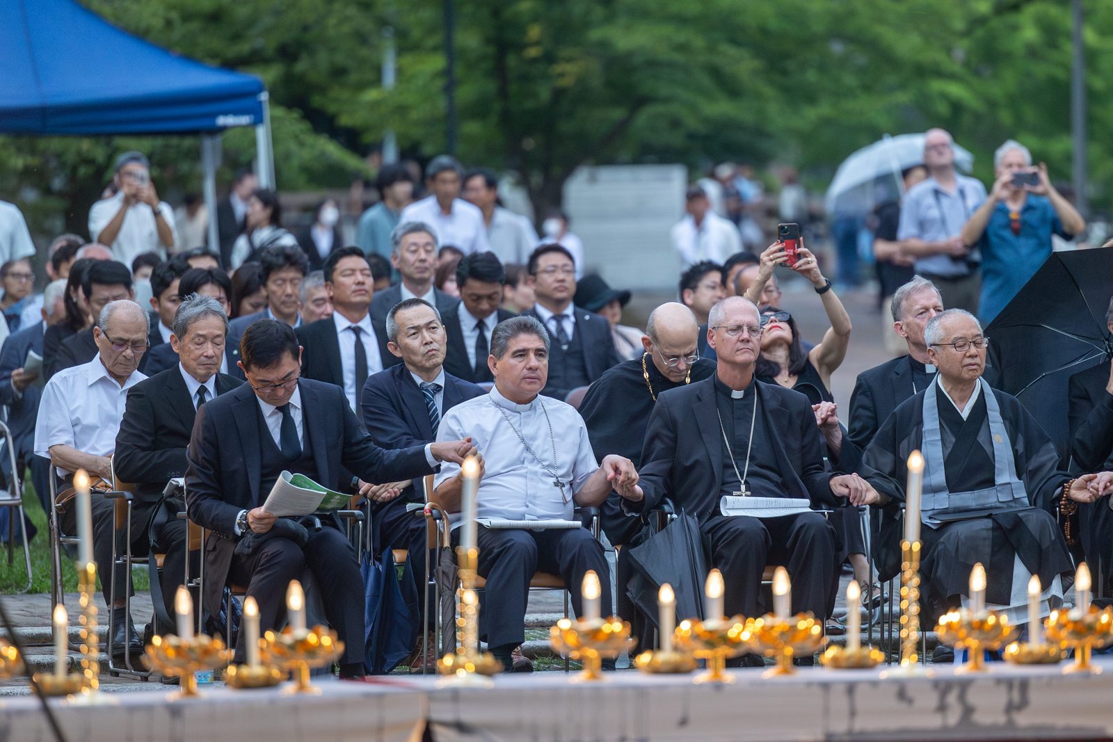 Participants in the 53rd Memorial Service for the Victims of the Atomic Bombing on Aug. 8, 2025 included, at center, Archbishop Francisco Escalante Molina, the Vatican’s apostolic nuncio to Japan, and Archbishop Paul D. Etienne of Seattle. The event was held at the Nagasaki Hypocenter Park, which is located at ground zero of the U.S. atomic bombing of Nagasaki on Aug. 9, 1945. (Catholic Standard photo by Mihoko Owada)