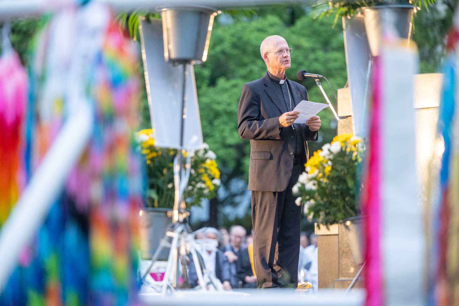 On the evening of Aug. 8, 2025, during the Memorial Service for the Victims of the Atomic Bombing, Archbishop Paul D. Etienne of Seattle offers "Words of Comfort" during the event at the Nagasaki Hypocenter Park. (Catholic Standard photo by Mihoko Owada)