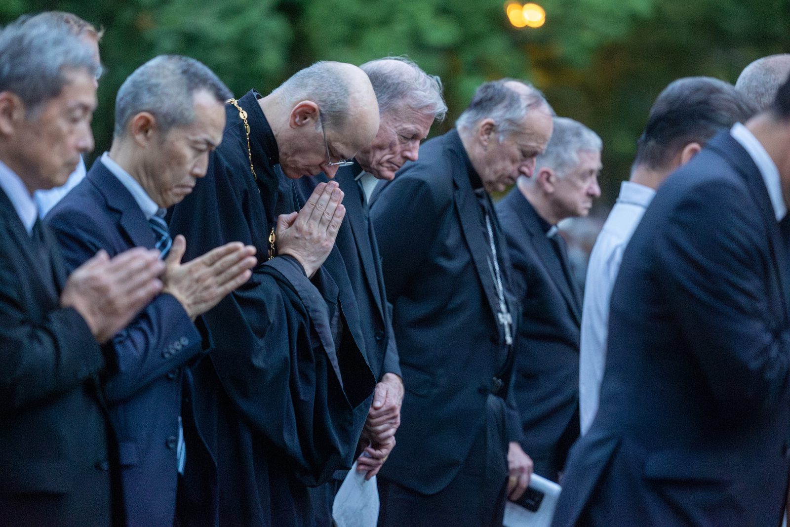 On the evening of Aug. 8, 2025, during the Memorial Service for the Victims of the Atomic Bombing, the attendees offering prayers included (from center to right) Archbishop John C. Wester of Santa Fe, New Mexico; Cardinal Robert W. McElroy of Washington; and Cardinal Blase J. Cupich of Chicago. The event was held at the Nagasaki Hypocenter Park. (Catholic Standard photo by Mihoko Owada)