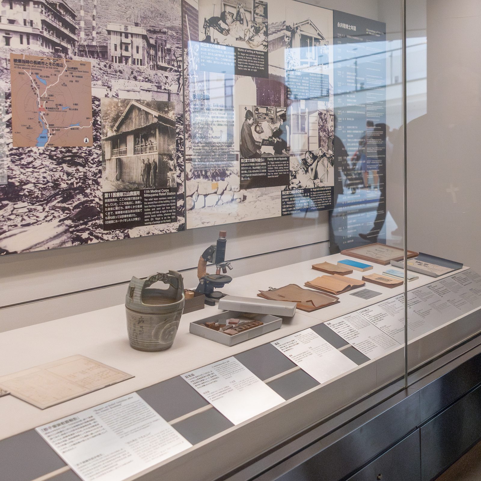 On August 8, 2025, Archbishop John C. Wester of Santa Fe, New Mexico looks at the exhibits closely during his visit to the Nagasaki Atomic Bomb Museum. (Catholic Standard photo by Mihoko Owada)