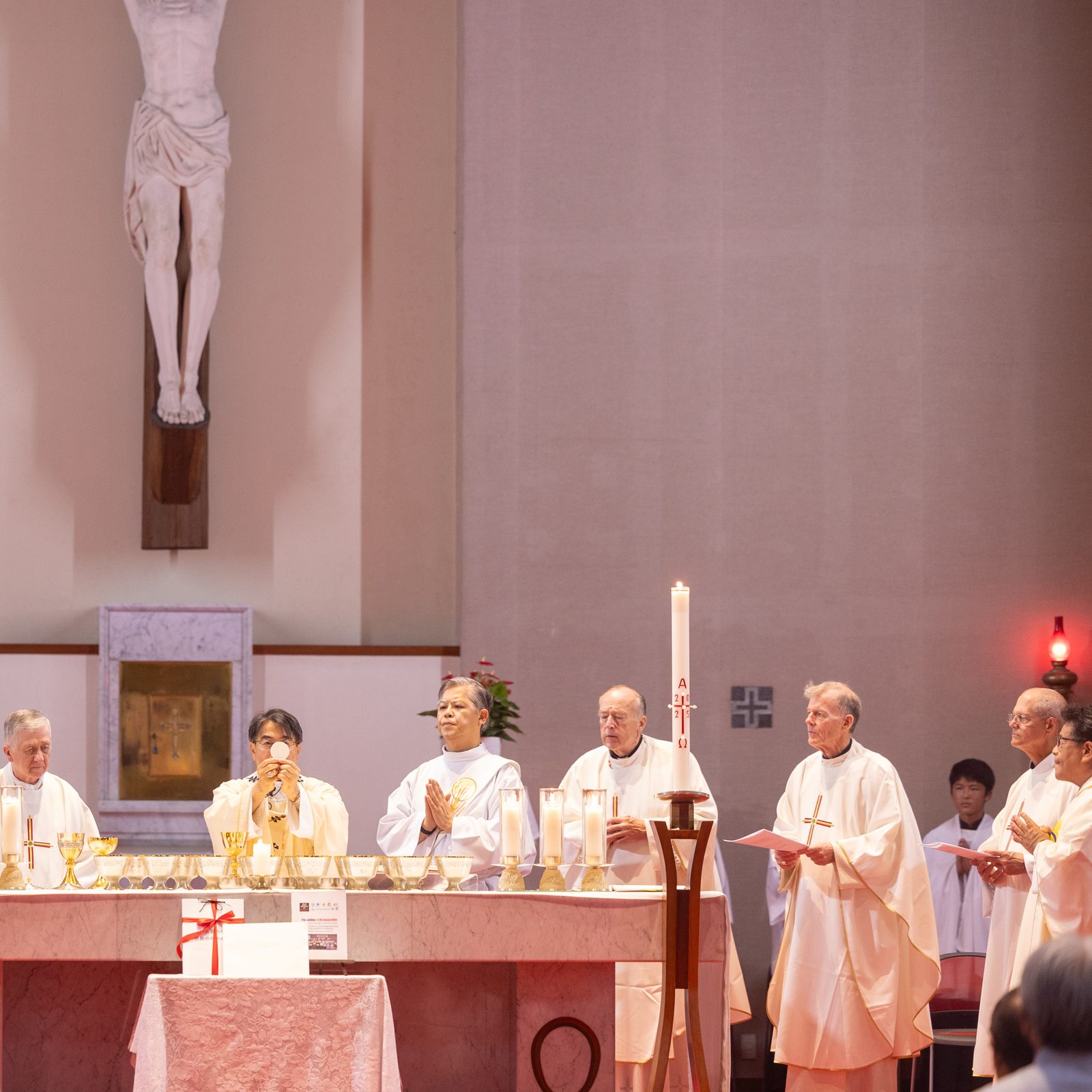 Archbishop Peter Michiaki Nakamura (at center) of Nagasaki, Japan, elevates the Eucharist during a Peace Memorial Mass at Urakami Cathedral in Nagasaki, Japan, on Aug. 9, 2025, on the day of the 8oth anniversary of the U.S. atomic bombing of that city. The concelebrants at the Mass included four U.S. archbishops participating in a Pilgrimage of Peace to Japan to commemorate the 80th anniversaries of the atomic bombings of Hiroshima and Nagasaki. At center to the left of Archbishop Nakamura is Cardinal Blase J. Cupich of Chicago. The concelebrants also included, at right next to Nagasaki’s archbishop and the assisting deacon, Cardinal Robert W. McElroy of Washington; Archbishop John C. Wester of Santa Fe, New Mexico; and Archbishop Paul D. Etienne of Seattle. (Catholic Standard photo by Mihoko Owada)