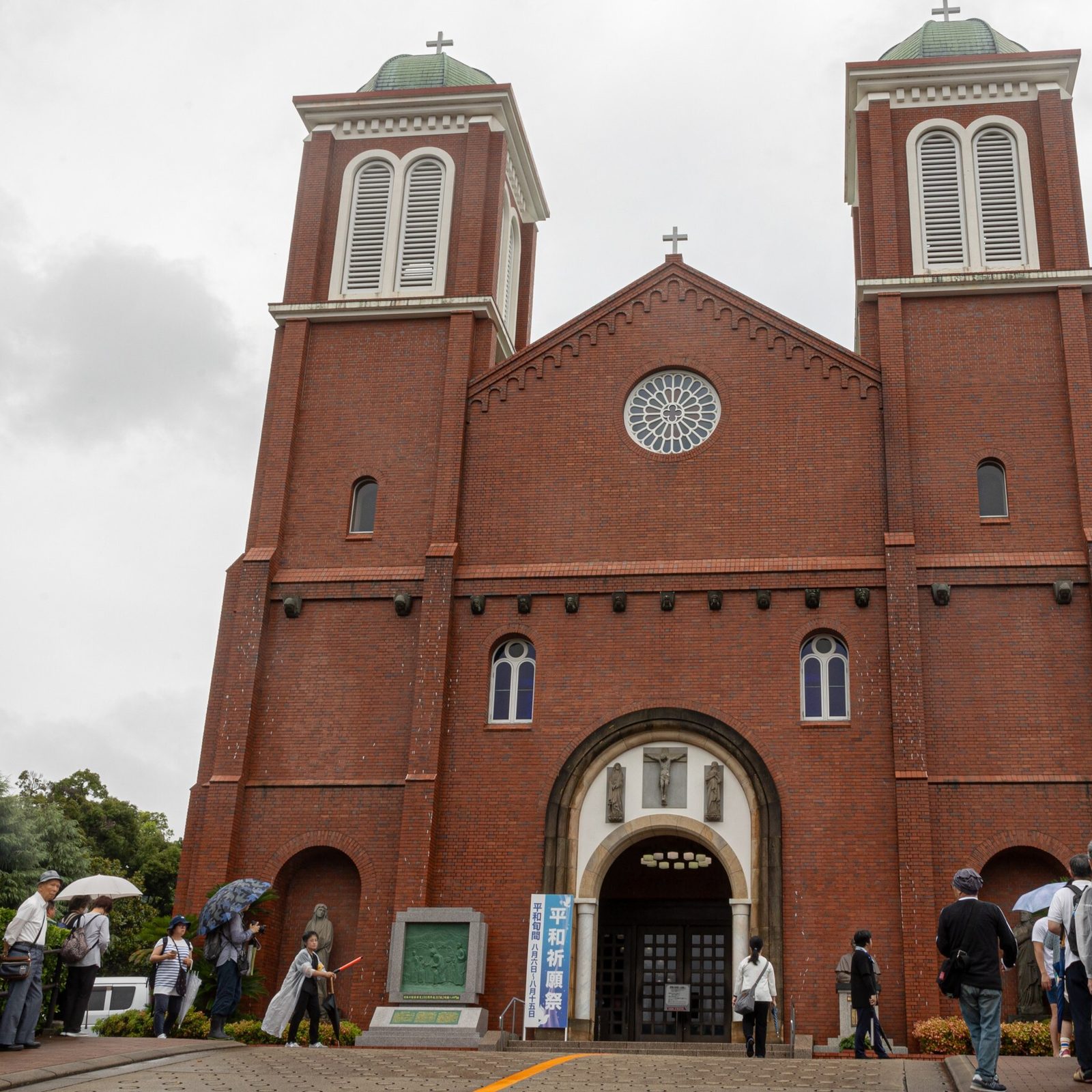 At 11:02 a.m. on August 9, 2025, as people offer silent prayers in front of Nagasaki's Urakami Cathedral, two bells ring out together for the first time in 80 years. One of these bells was recast for the cathedral by American Catholics. The bells rang out on the 80th anniversary of the moment when the atomic bomb dropped by the United States exploded over Nagasaki on Aug. 9, 1945. (Catholic Standard photo by Mihoko Owada)