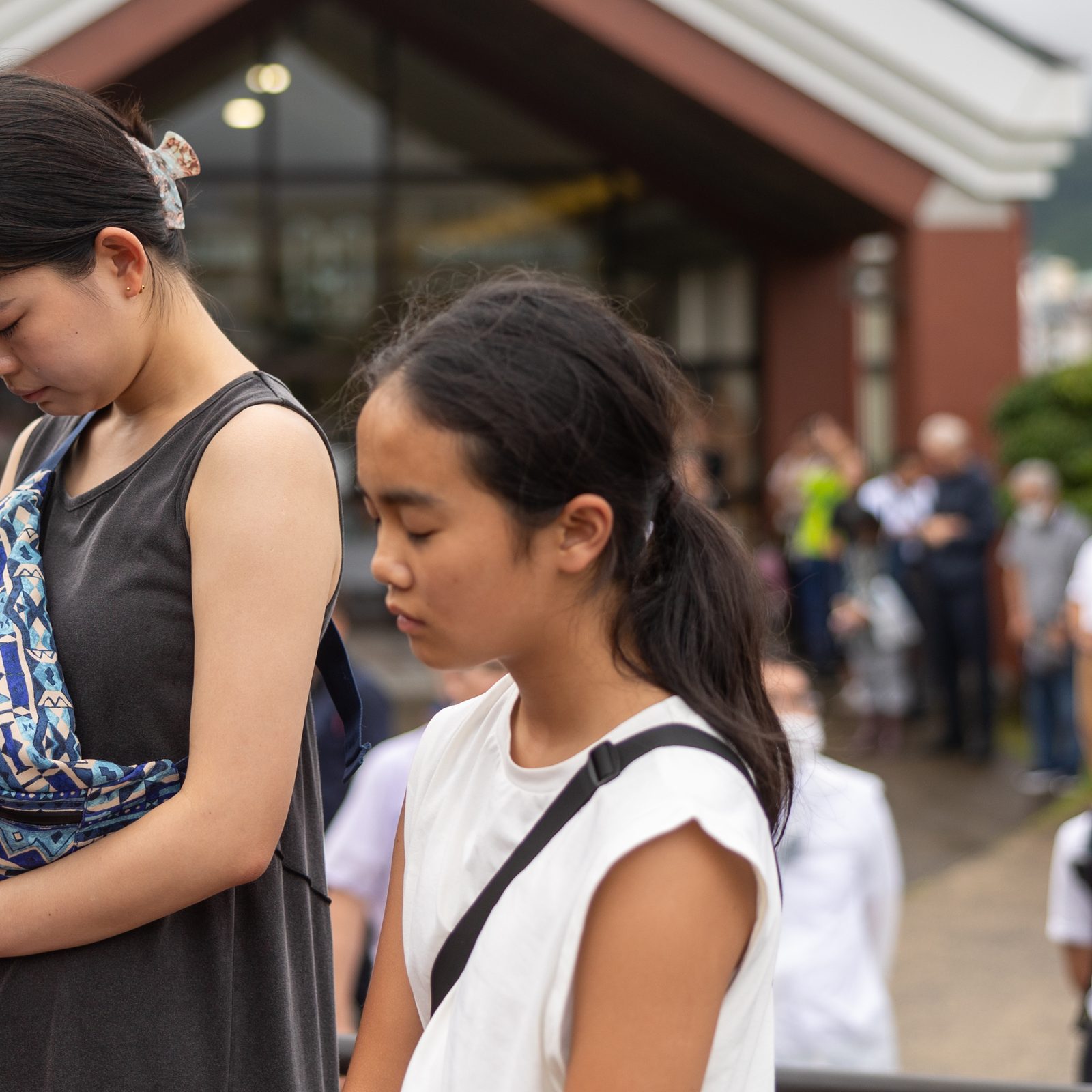 At 11:02 a.m. on August 9, 2025, as people offer silent prayers in front of Nagasaki's Urakami Cathedral, two bells ring out together for the first time in 80 years. One of these bells was recast for the cathedral by American Catholics. The bells rang out on the 80th anniversary of the moment when the atomic bomb dropped by the United States exploded over Nagasaki on Aug. 9, 1945. (Catholic Standard photo by Mihoko Owada)