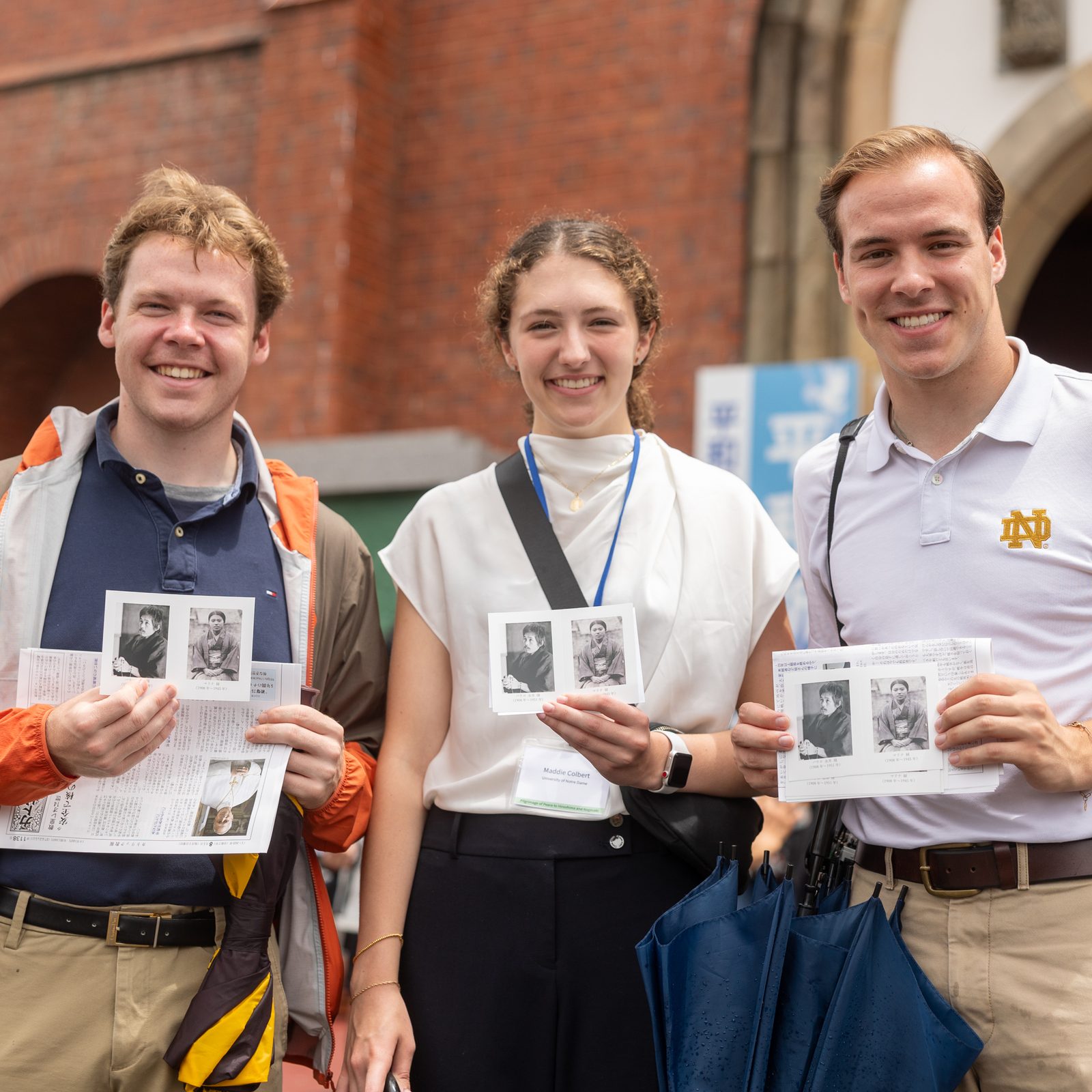 Students from U.S. universities hold prayer cards of Takashi and Midori Nagai they received after participating in the 11 a.m. Mass on Aug. 9, 2025 at Urakami Cathedral in Nagasaki that was held on the 80th anniversary of the U.S. atomic bombing of that city on Aug. 9, 1945. Dr. Takashi Nagai, a physician and radiologist who cared for survivors in the aftermath of the bombing, returned home to find the charred remains of his wife along with her melted rosary. Dr. Nagai, a convert to Catholicism, became a well-known advocate for peace and forgiveness until he died of leukemia in 1951. The couple is being considered for canonization. (Catholic Standard photo by Mihoko Owada)