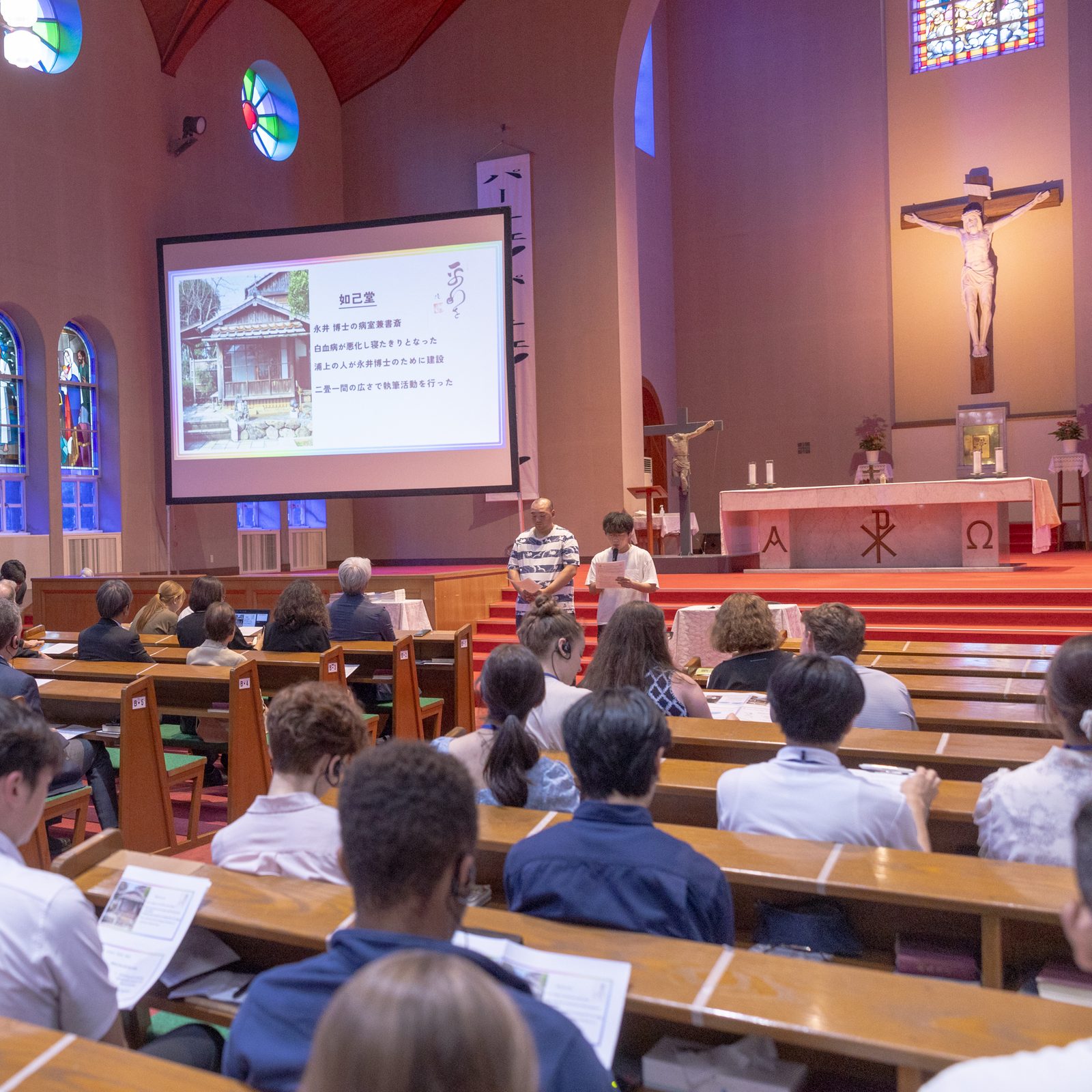 At the symposium “Walking Together: A Gathering of Pilgrims for Peace” at Urakami Cathedral on August 10, the Youth Ministry of the Archdiocese of Nagasaki gives a presentation on the life of Dr. Takashi Nagai. (Catholic Standard photo by Mihoko Owada)