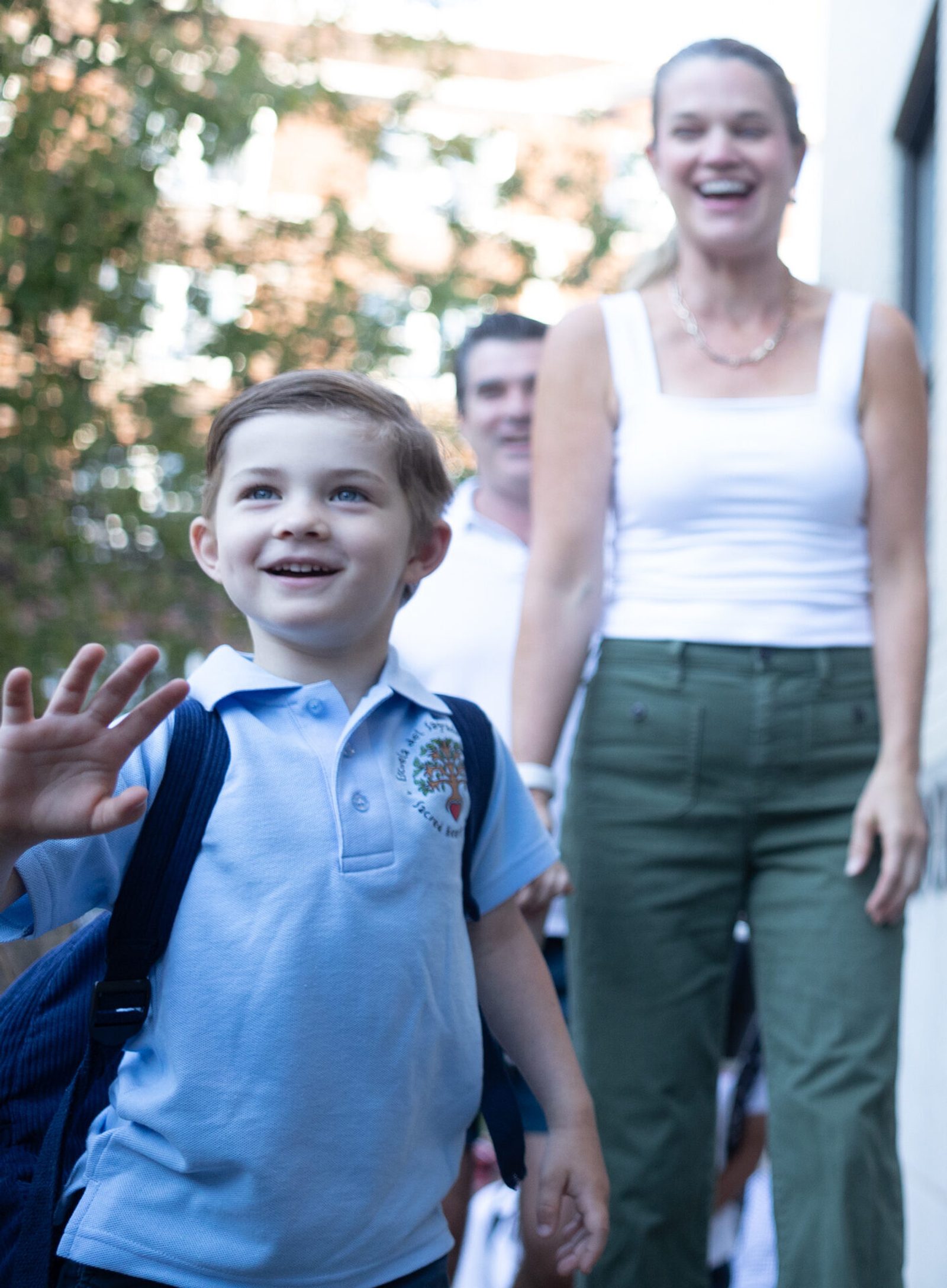 William Maloney (kindergarten) and his parents are welcomed at Sacred Heart School in Washington, D.C., on the first day of school, August 26, 2025. (Catholic Standard photo by Mihoko Owada)