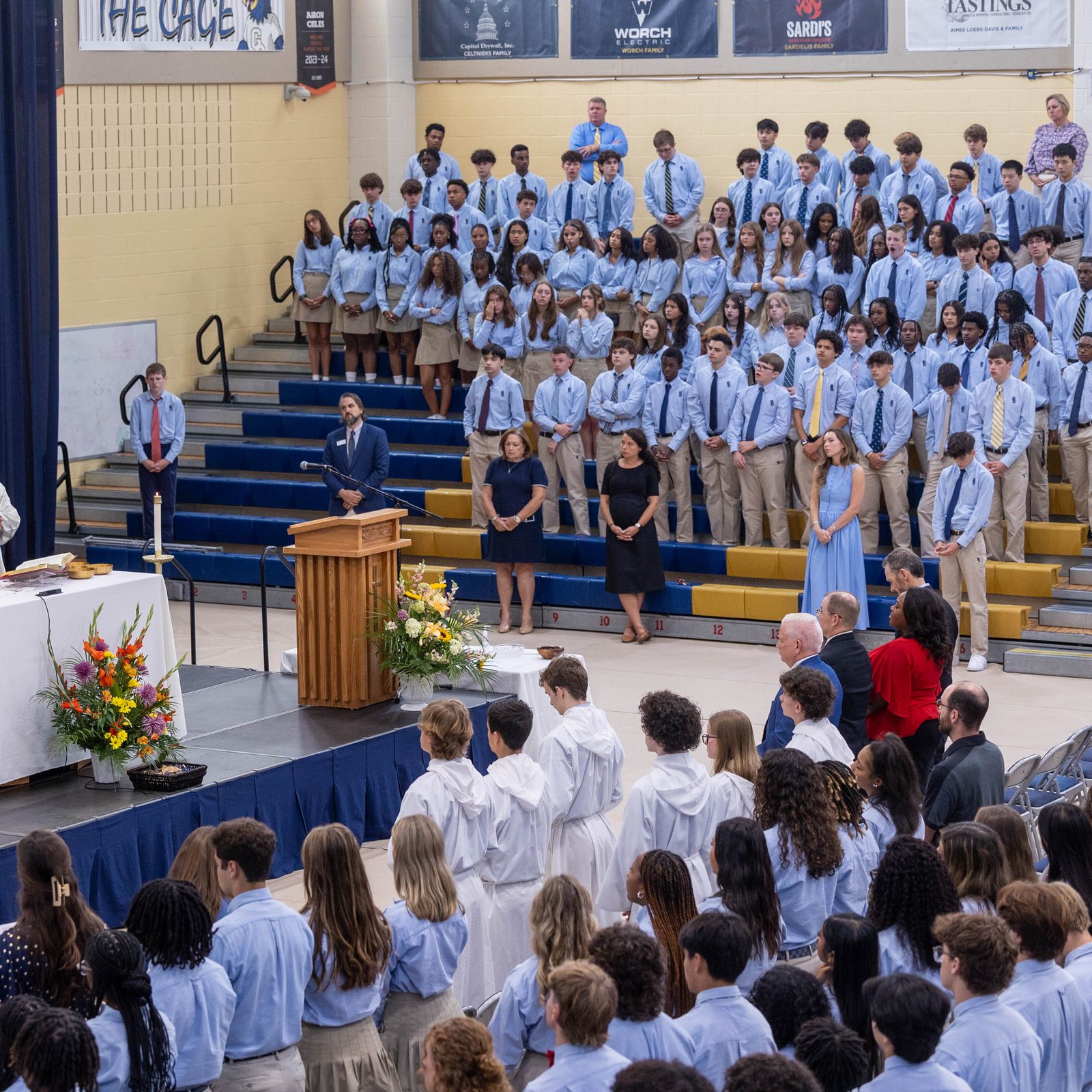 Washington Cardinal Wilton Gregory celebrates the opening school year Mass on Aug. 29 at Our Lady of Good Counsel High School in Olney on Aug. 29. Standing beside the cardinal at left is Conventual Franciscan Father Tom Lavin, the school’s chaplain. At right is Father Kevin Regan, the cardinal’s priest secretary. (Catholic Standard photo by Mihoko Owada)