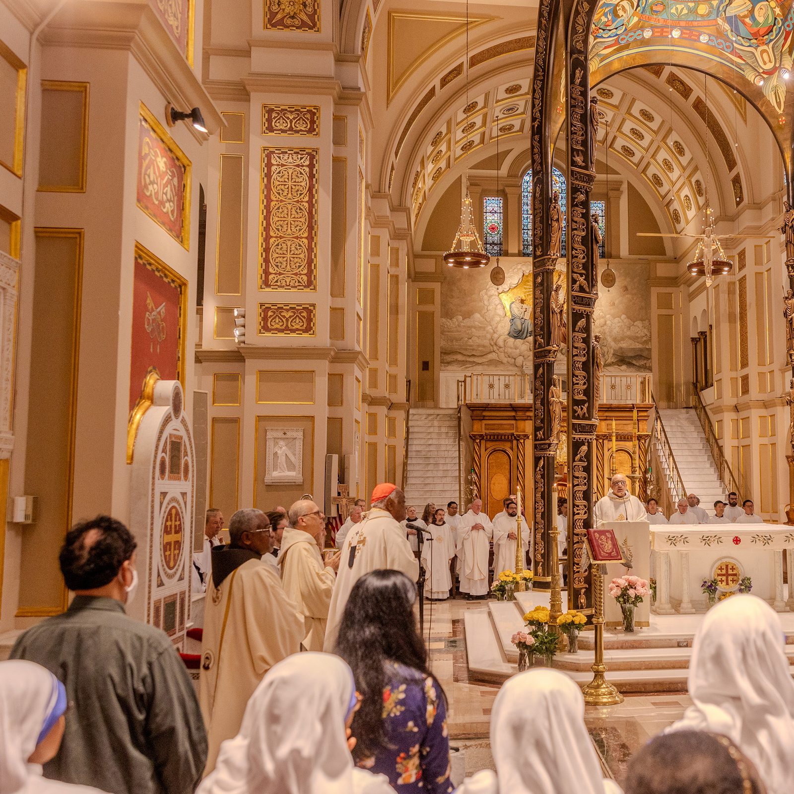 Franciscan Father Ramzi Sidawi, guardian of the Franciscan Monastery, stands near the altar as he welcomes Cardinal Wilton Gregory and the faithful to the celebration of the monastery’s 125th. (Catholic Standard photo by Mihoko Owada)