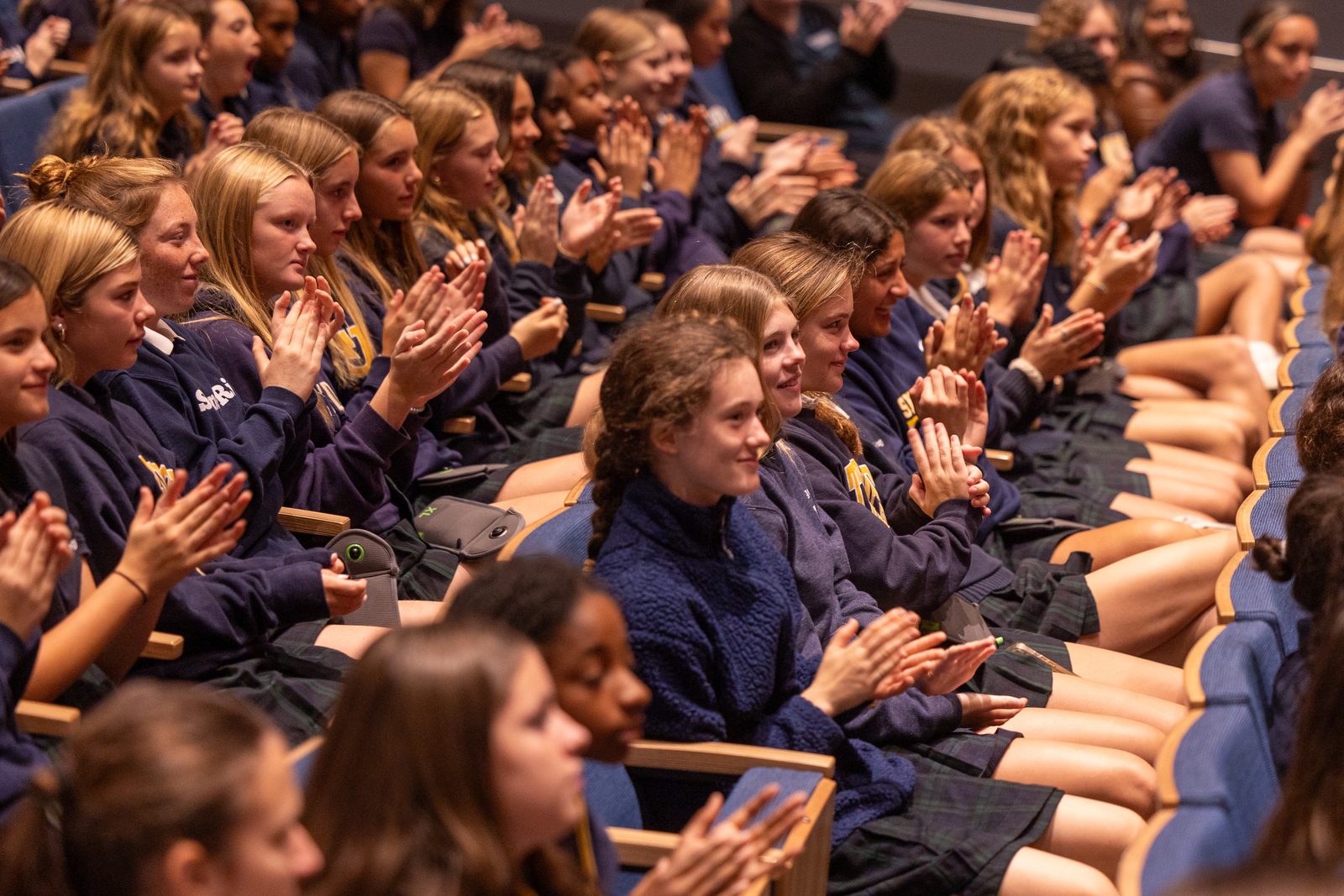 Stone Ridge Middle School students applaud during a visit by Olympic champion swimmer Katie Ledecky to her alma mater, Stone Ridge School of the Sacred Heart in Bethesda, Maryland, on Oct. 22, 2024. (Catholic Standard photo by Mihoko Owada)