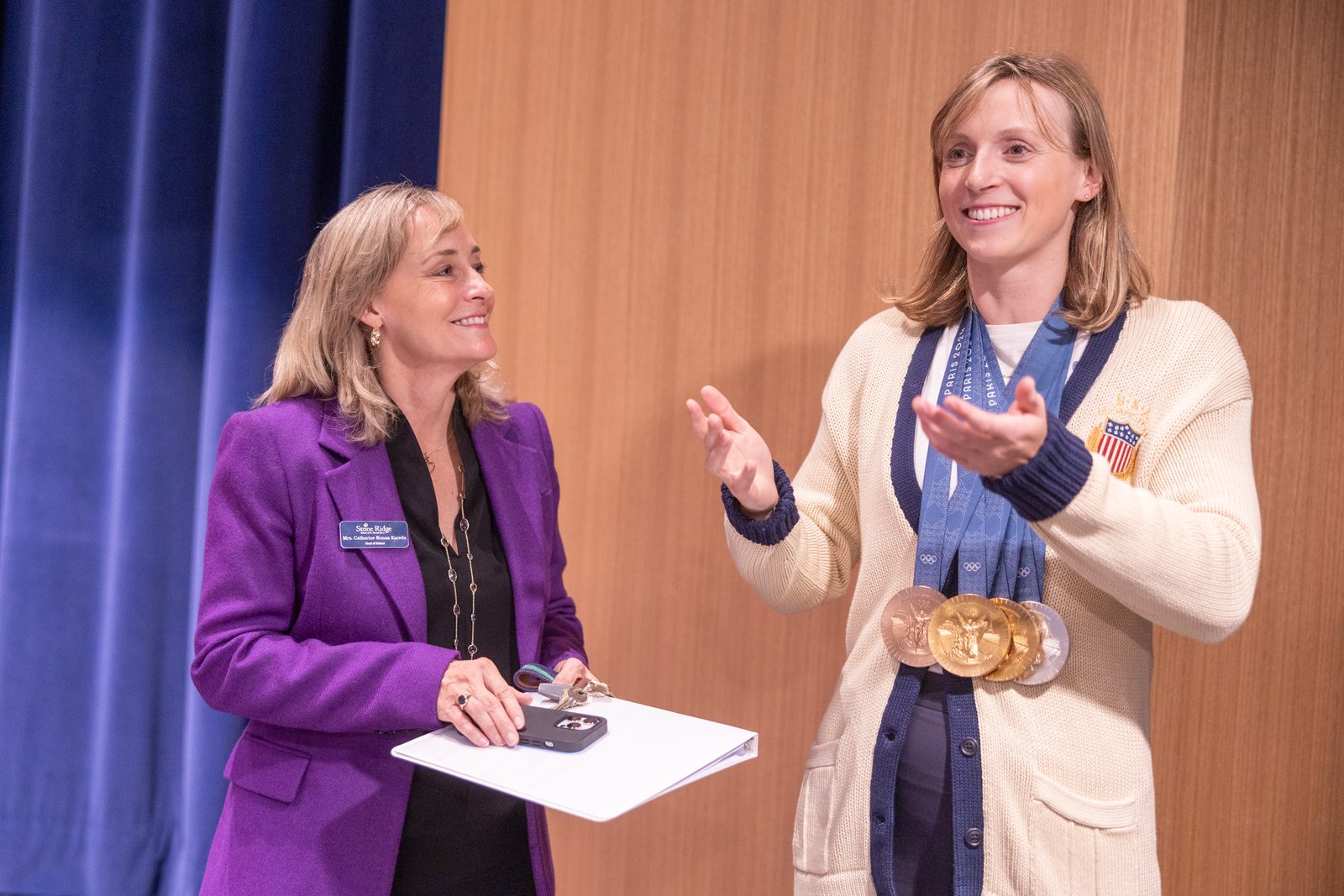 During a visit to her alma mater, Stone Ridge School of the Sacred Heart in Bethesda, Maryland, on Oct. 22, 2024, Olympic champion swimmer Katie Ledecky stands with Catherine Ronan Karrels, the Head of School at Stone Ridge. Ledecky is a 2015 graduate of Stone Ridge, and Karrels is a 1986 graduate of the school. Ledecky returned to Stone Ridge to visit with students and tell them about her experiences at the 2024 Summer Olympic Games in Paris, where she won two gold medals, a silver medal and a bronze medal. (Catholic Standard photo by Mihoko Owada)