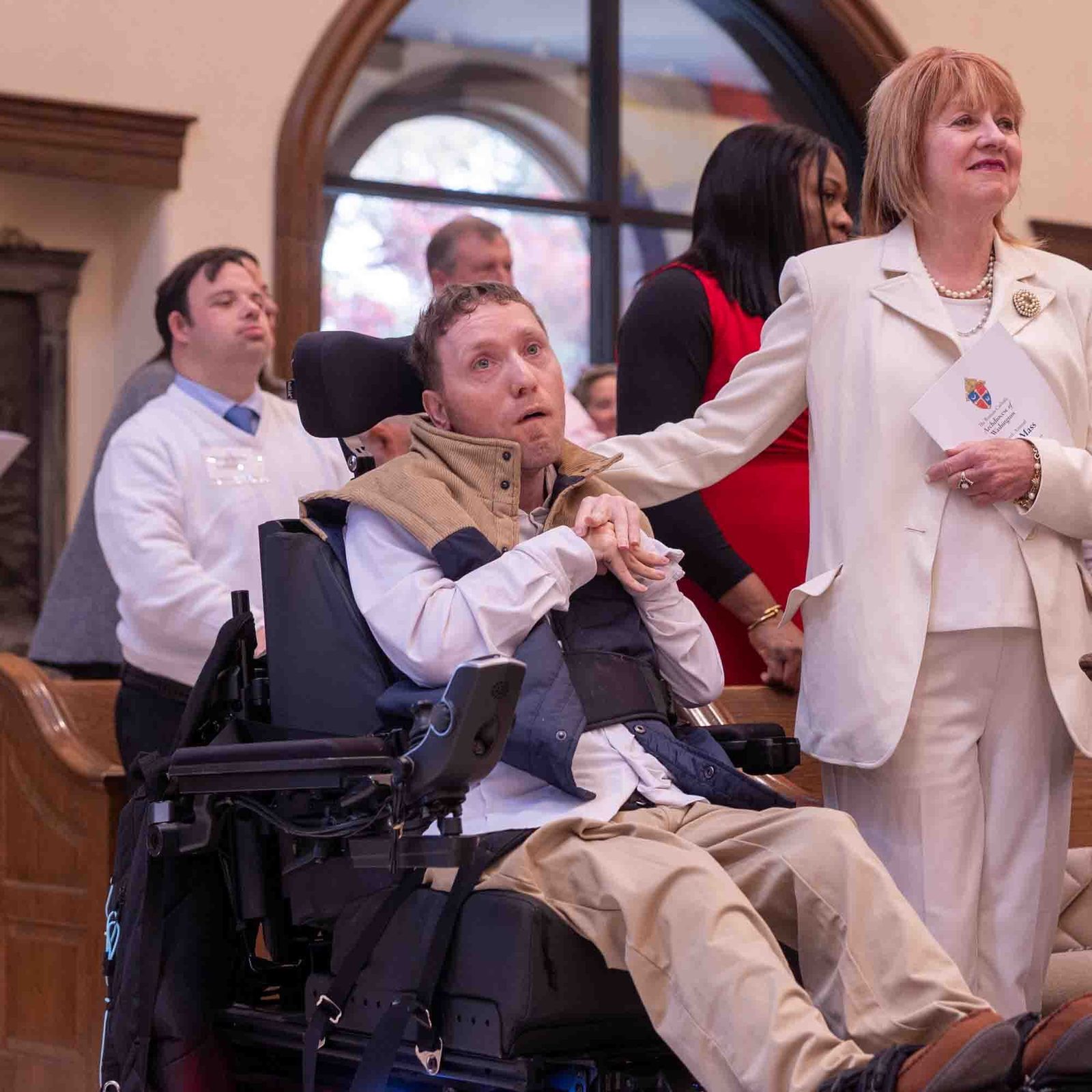 Michael Quinn at left is joined by his mother Ann Quinn at the White Mass on Oct. 26 at Our Lady of Mercy Church in Potomac. (Catholic Standard photo by Mihoko Owada)